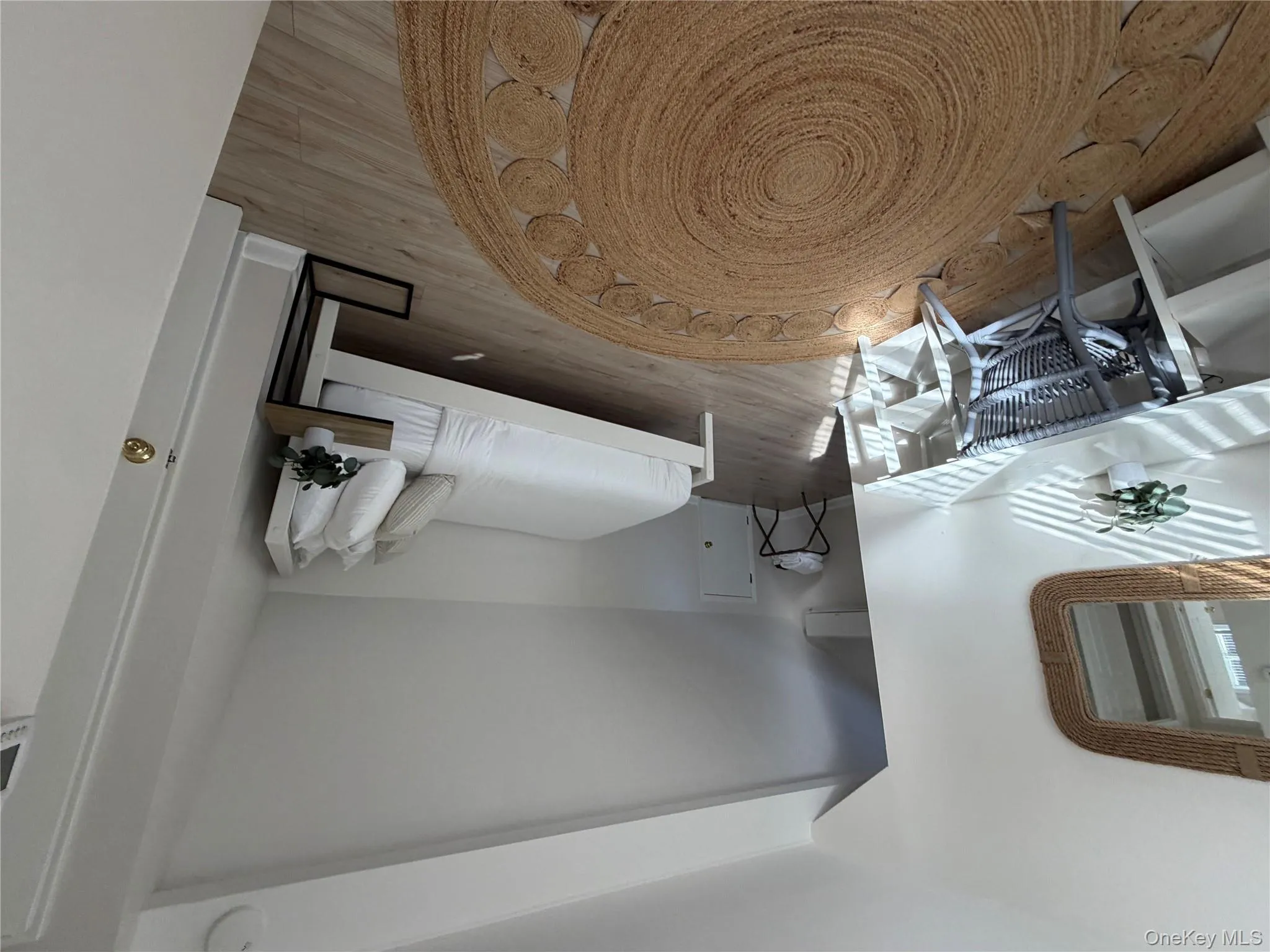 Bedroom with lofted ceiling and light wood-style flooring Bedroom with lofted ceiling and light wood-style flooring