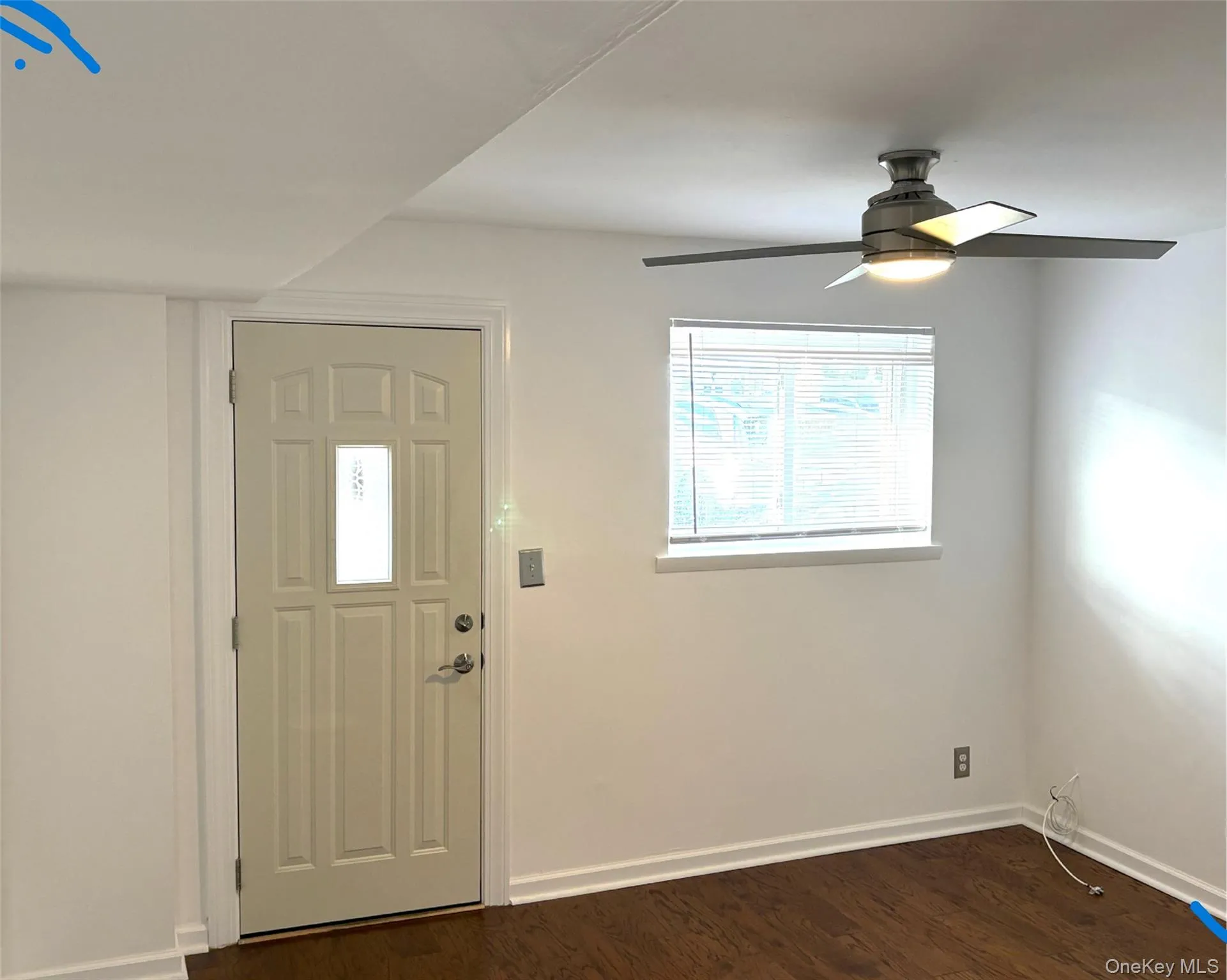 Entrance with dark wood flooring Entrance with dark wood flooring