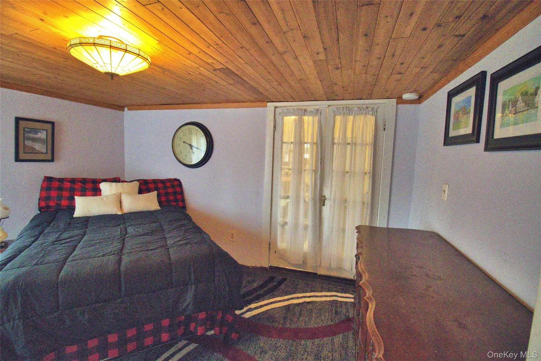 Bedroom featuring wood ceiling Bedroom featuring wood ceiling