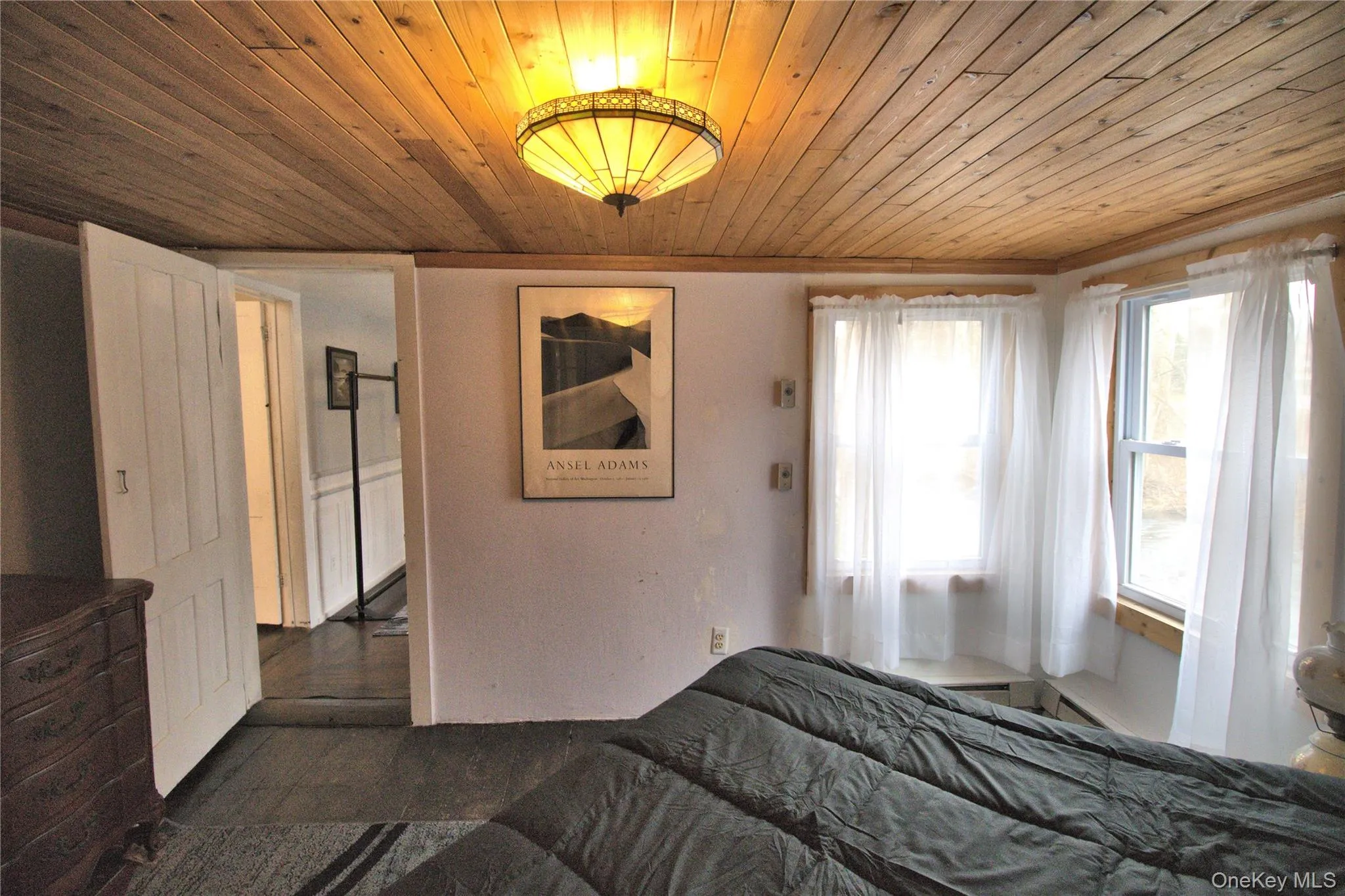 Bedroom featuring wood ceiling Bedroom featuring wood ceiling