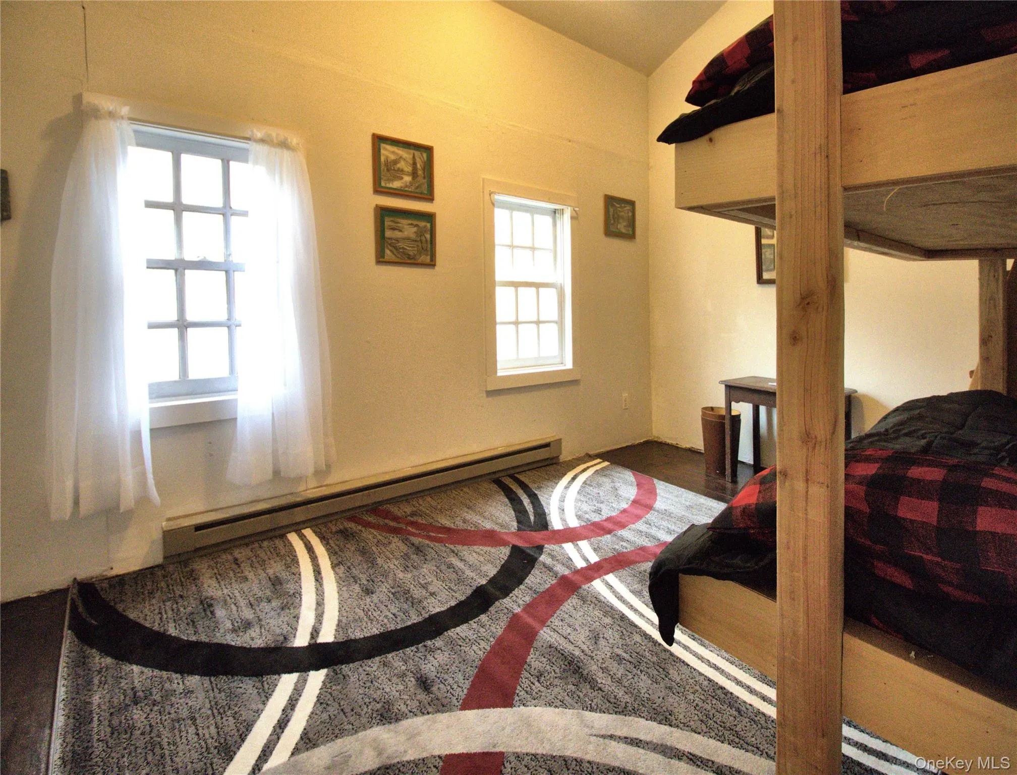 Bedroom featuring baseboard heating Bedroom featuring baseboard heating