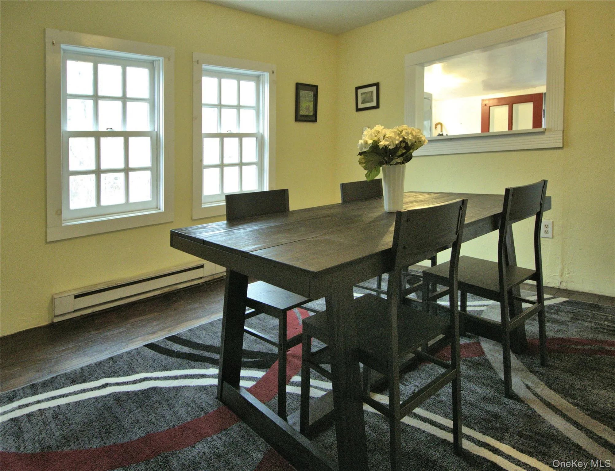 Dining room featuring a baseboard radiator Dining room featuring a baseboard radiator