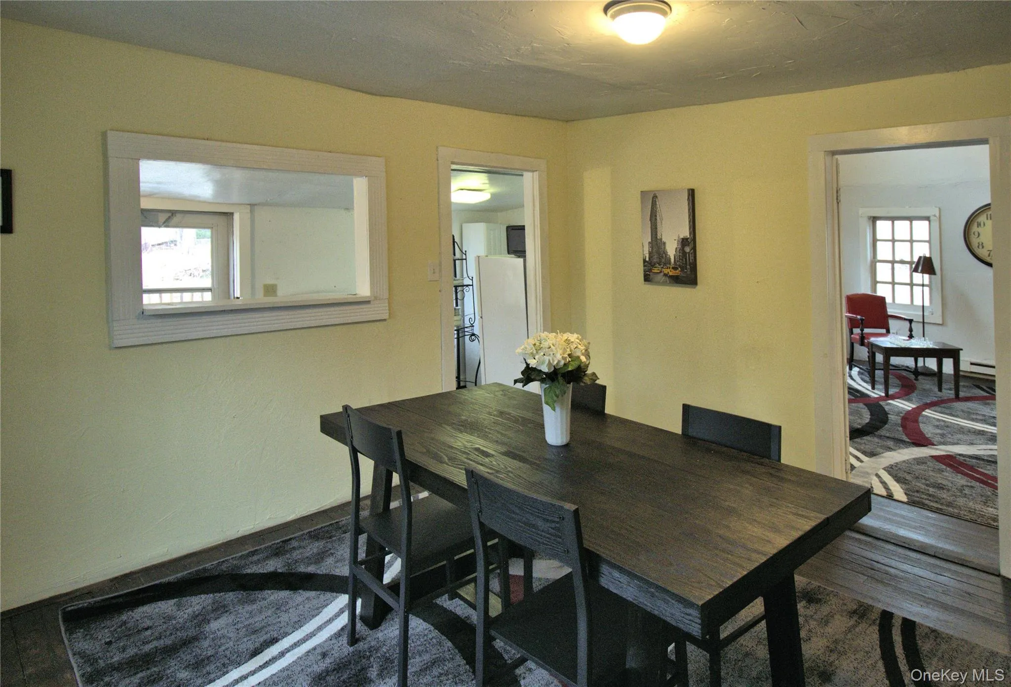 Dining area with dark wood-style floors Dining area with dark wood-style floors