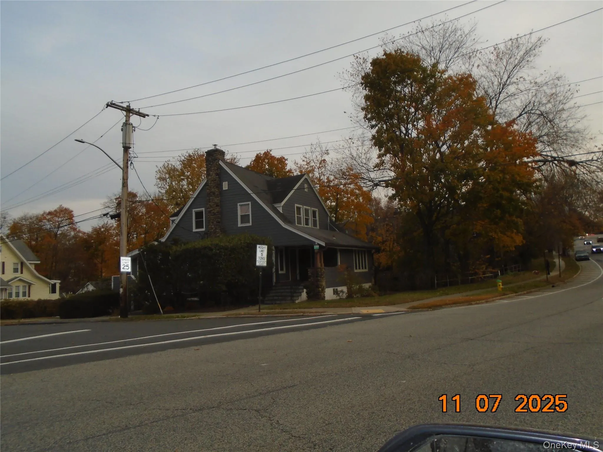 View of front of house featuring a chimney View of front of house featuring a chimney