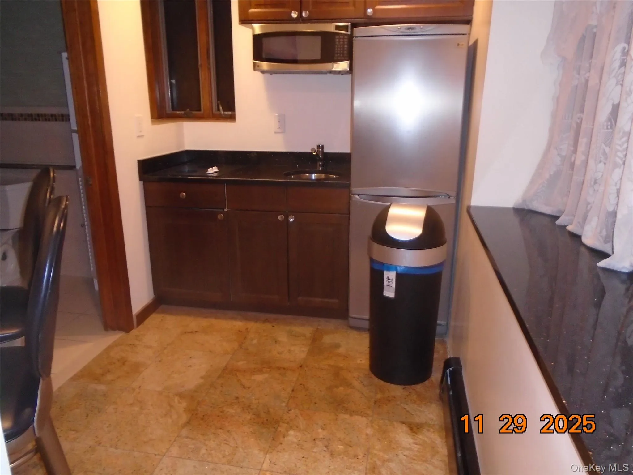 Kitchen featuring appliances with stainless steel finishes and a sink Kitchen featuring appliances with stainless steel finishes and a sink