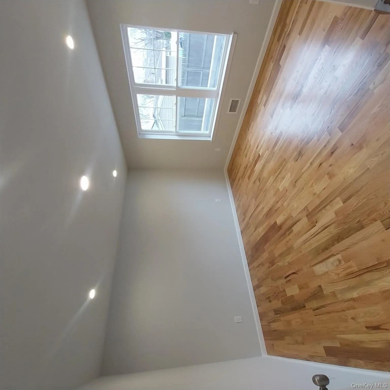 Spare room featuring light wood-style flooring and recessed lighting Spare room featuring light wood-style flooring and recessed lighting