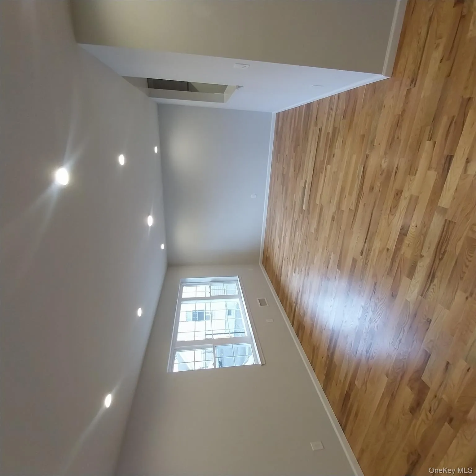 Empty room featuring recessed lighting and light wood-style floors Empty room featuring recessed lighting and light wood-style floors