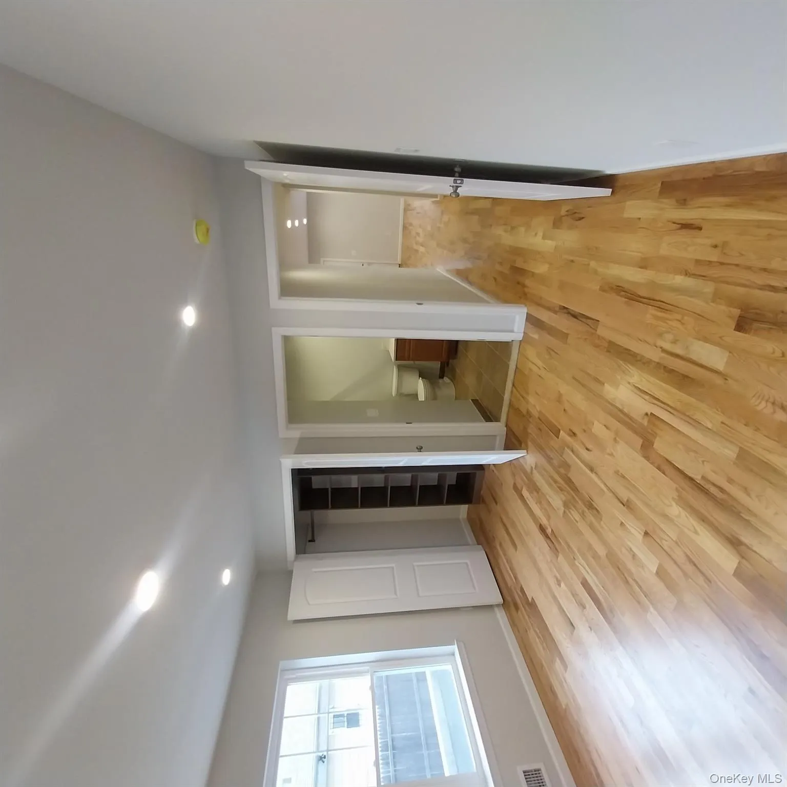 Unfurnished bedroom featuring light wood finished floors, ensuite bath, and recessed lighting Unfurnished bedroom featuring light wood finished floors, ensuite bath, and recessed lighting