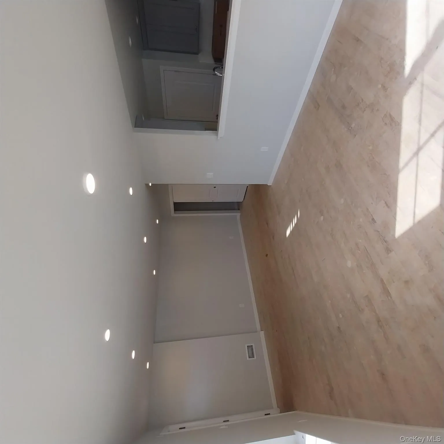 Empty room with recessed lighting and light wood-style flooring Empty room with recessed lighting and light wood-style flooring