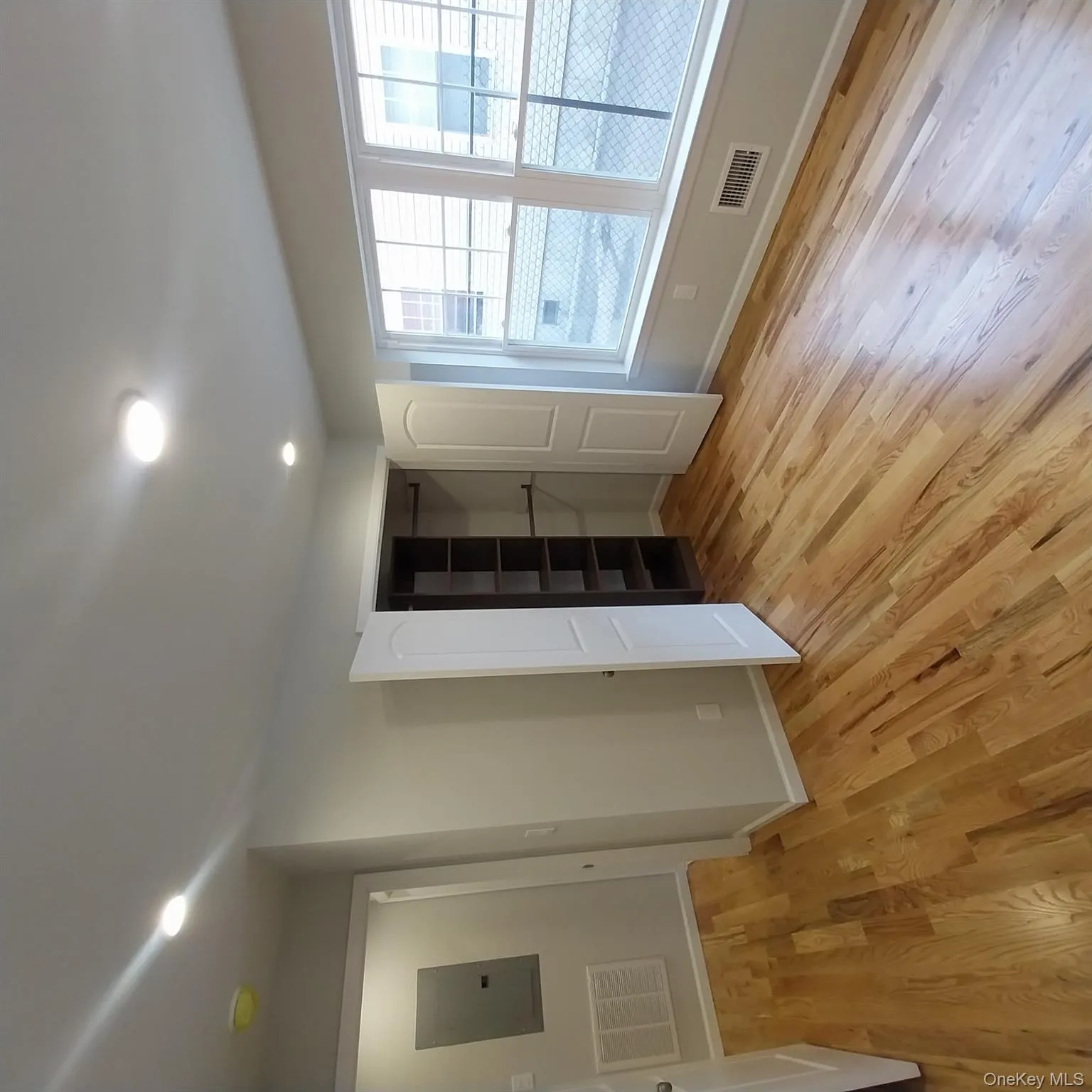 Unfurnished bedroom with electric panel, light wood-type flooring, recessed lighting, and a closet Unfurnished bedroom with electric panel, light wood-type flooring, recessed lighting, and a closet