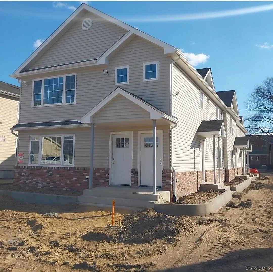 View of front of home featuring covered porch and brick siding View of front of home featuring covered porch and brick siding
