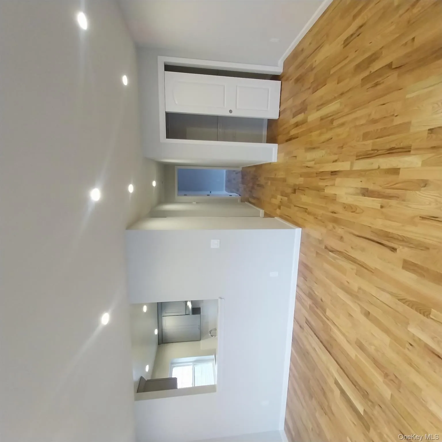 Spare room with light wood-style floors and recessed lighting Spare room with light wood-style floors and recessed lighting