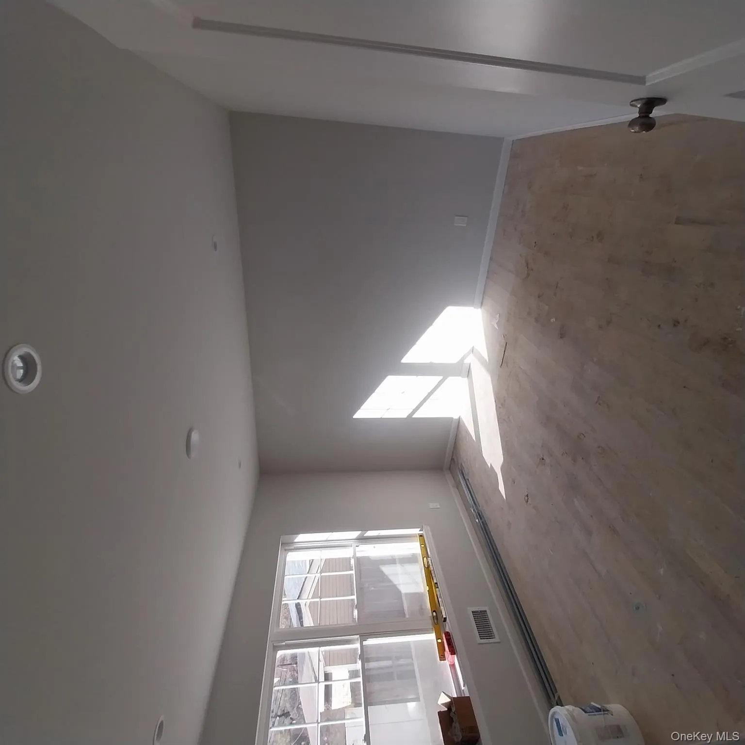 Spare room featuring baseboards and wood finished floors Spare room featuring baseboards and wood finished floors