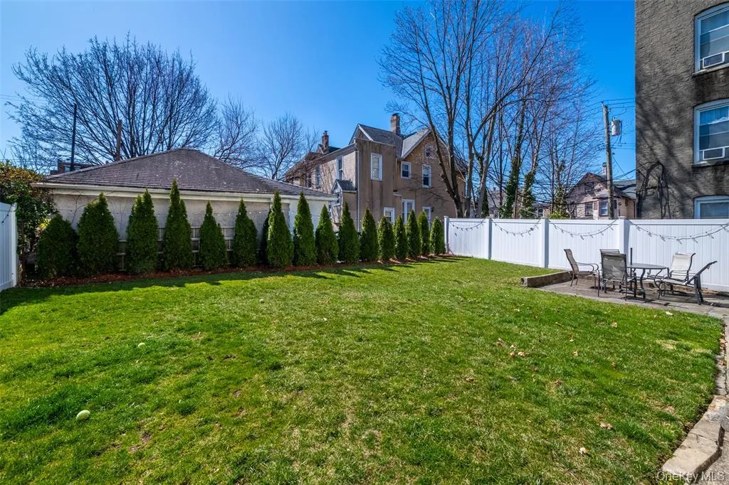 Fenced backyard featuring a patio area Fenced backyard featuring a patio area