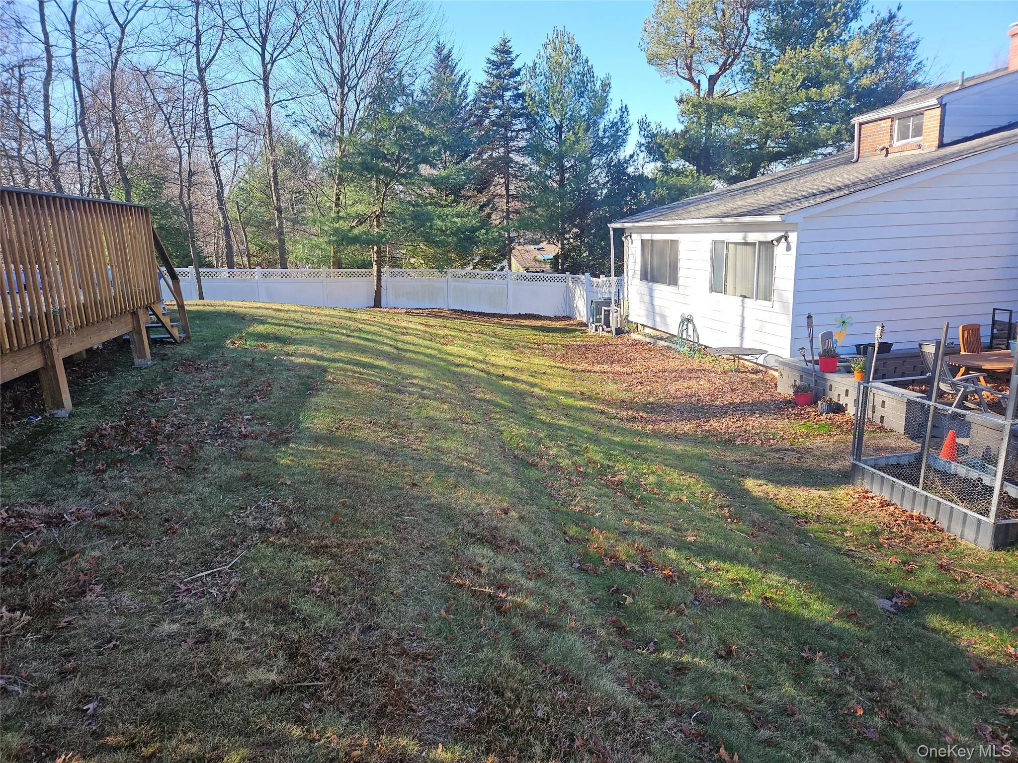 Fenced backyard with a vegetable garden Fenced backyard with a vegetable garden