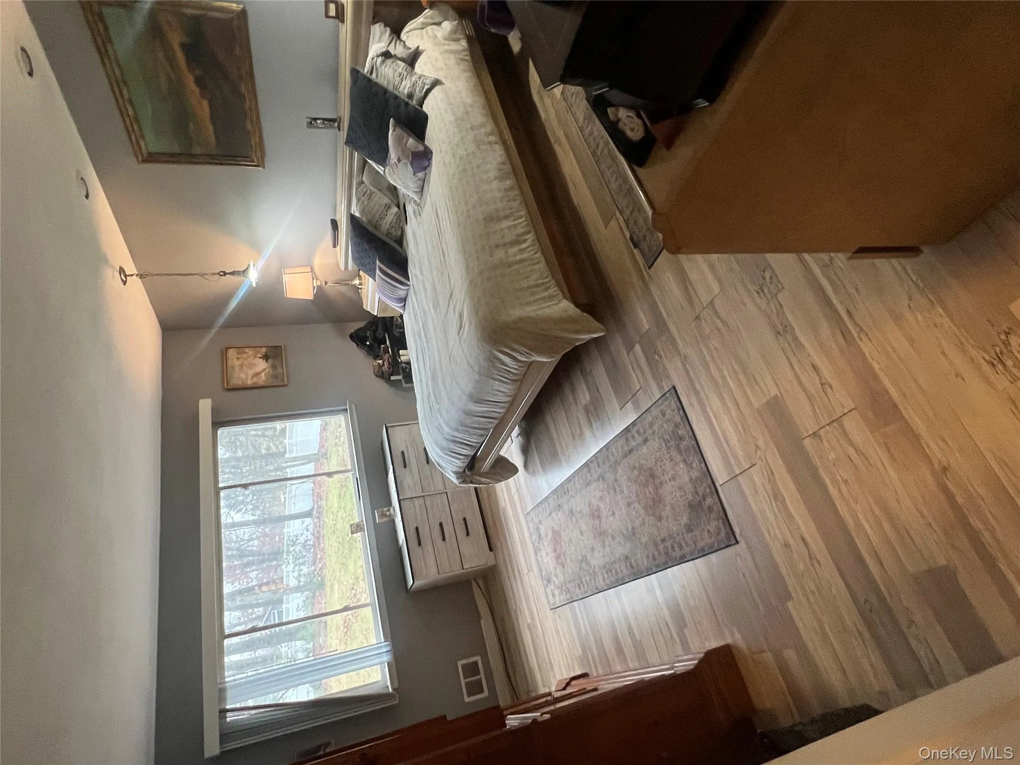 Bedroom with light wood finished floors Bedroom with light wood finished floors