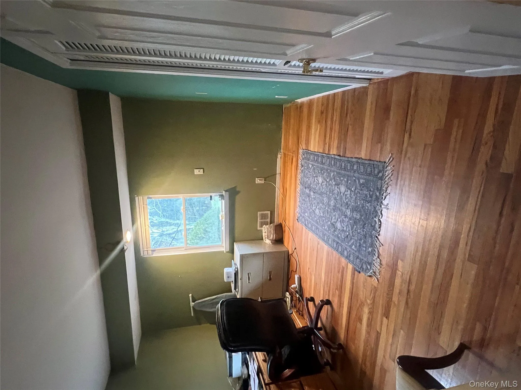 Home office featuring wood finished floors Home office featuring wood finished floors