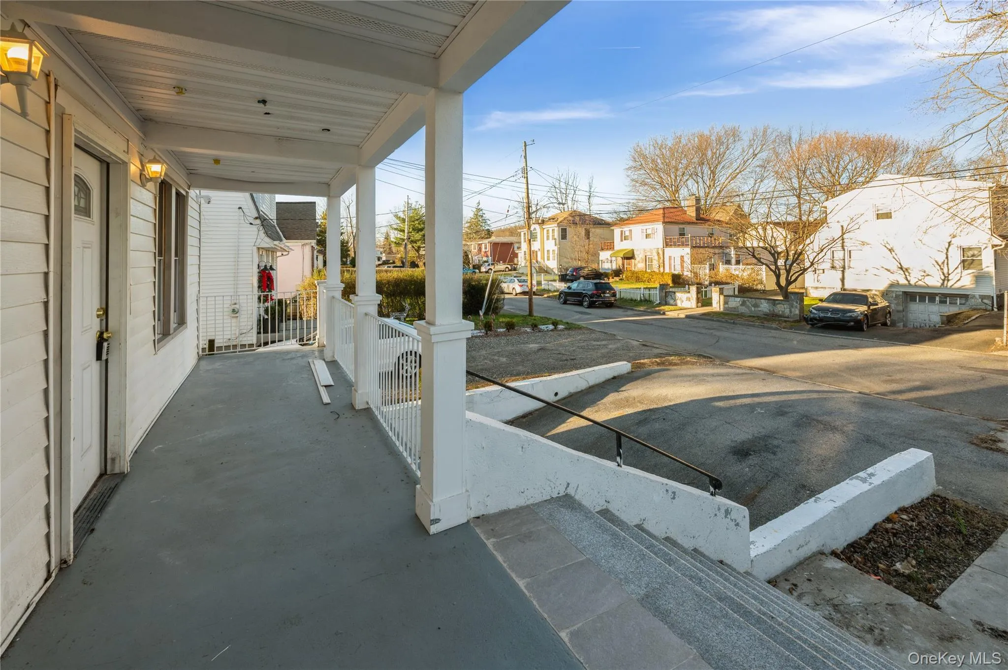 Covered porch featuring a residential view Covered porch featuring a residential view