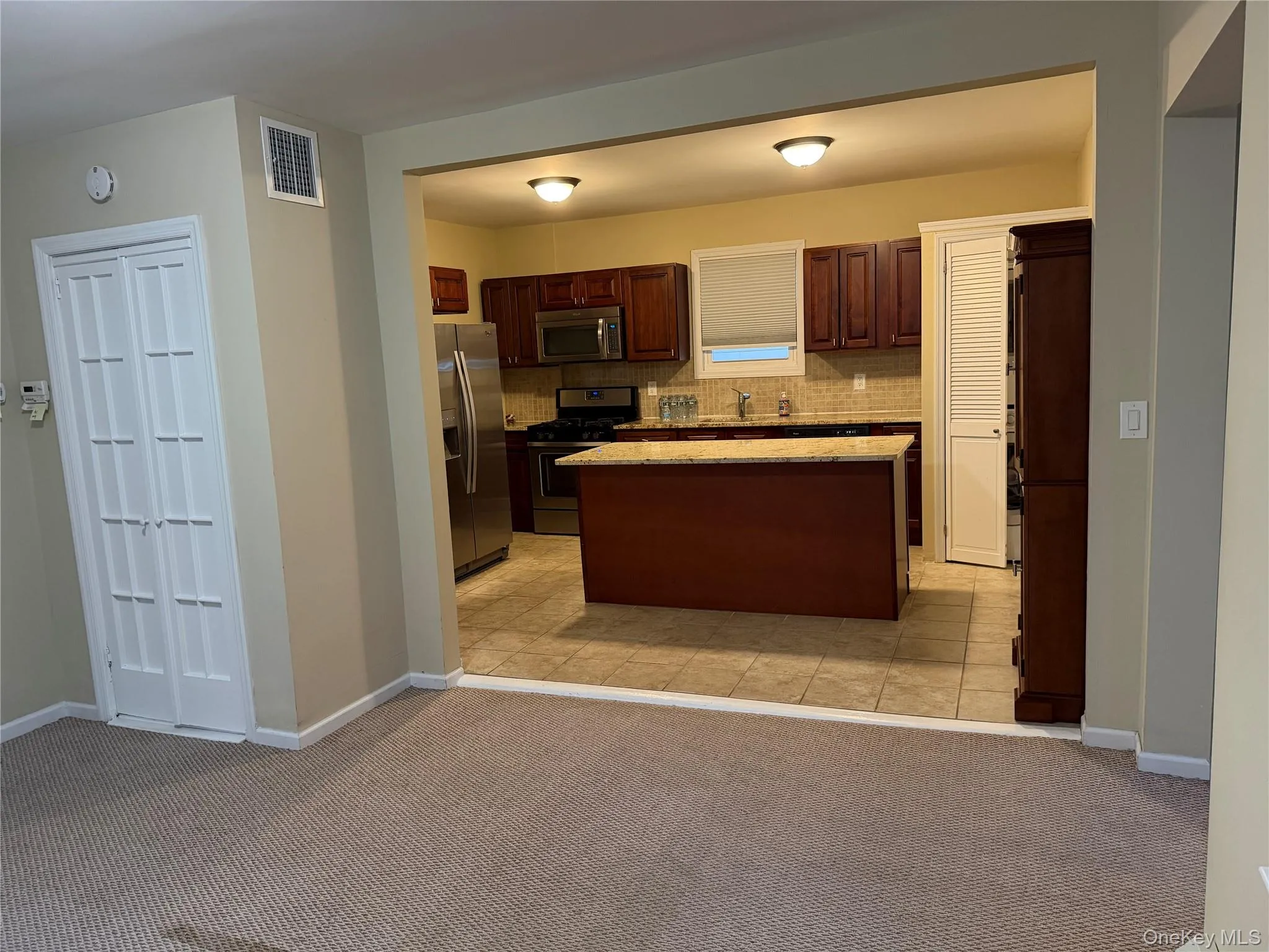 Part of living room into kitchen Part of living room into kitchen