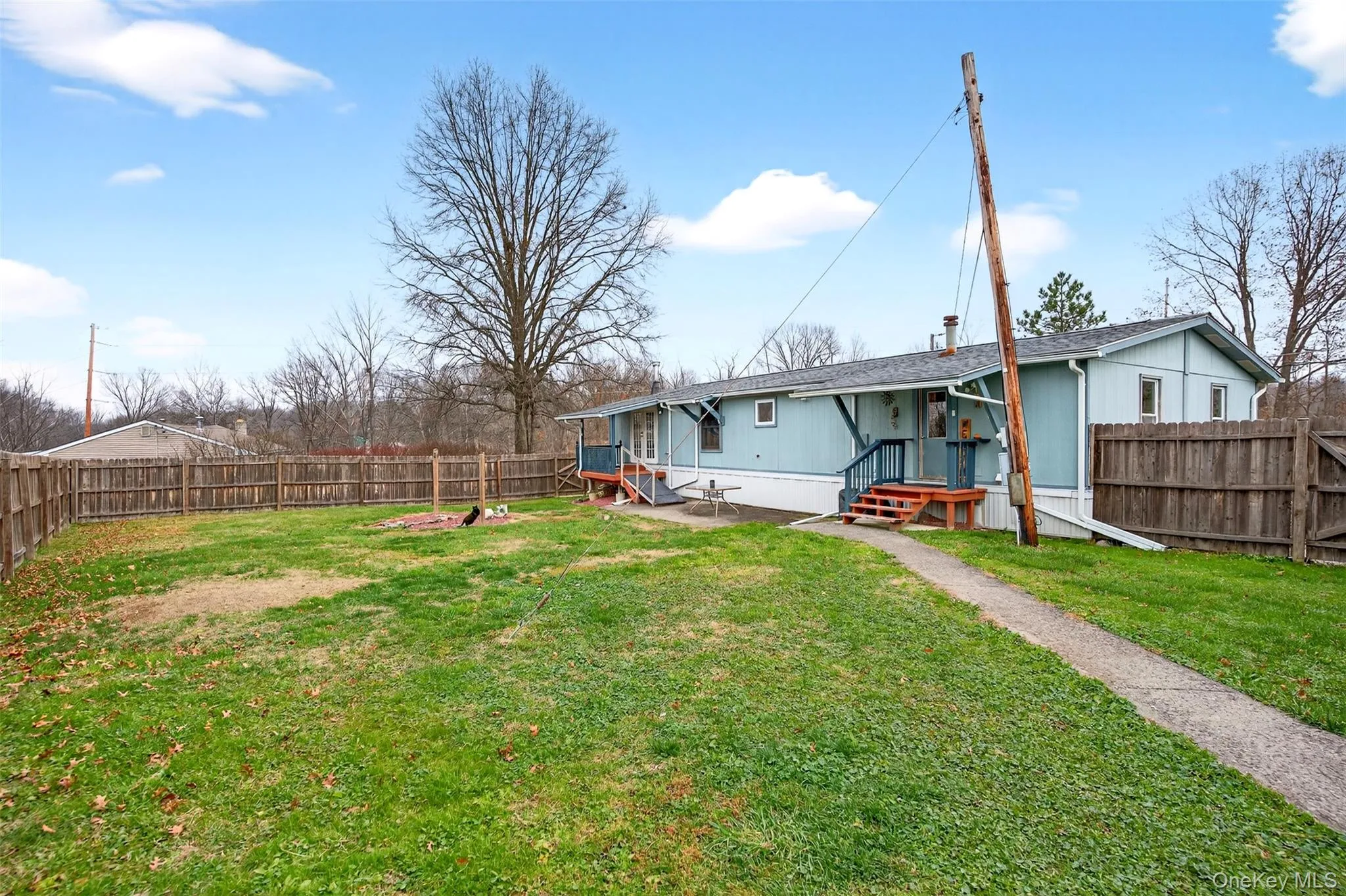 Back of property featuring a fenced backyard Back of property featuring a fenced backyard