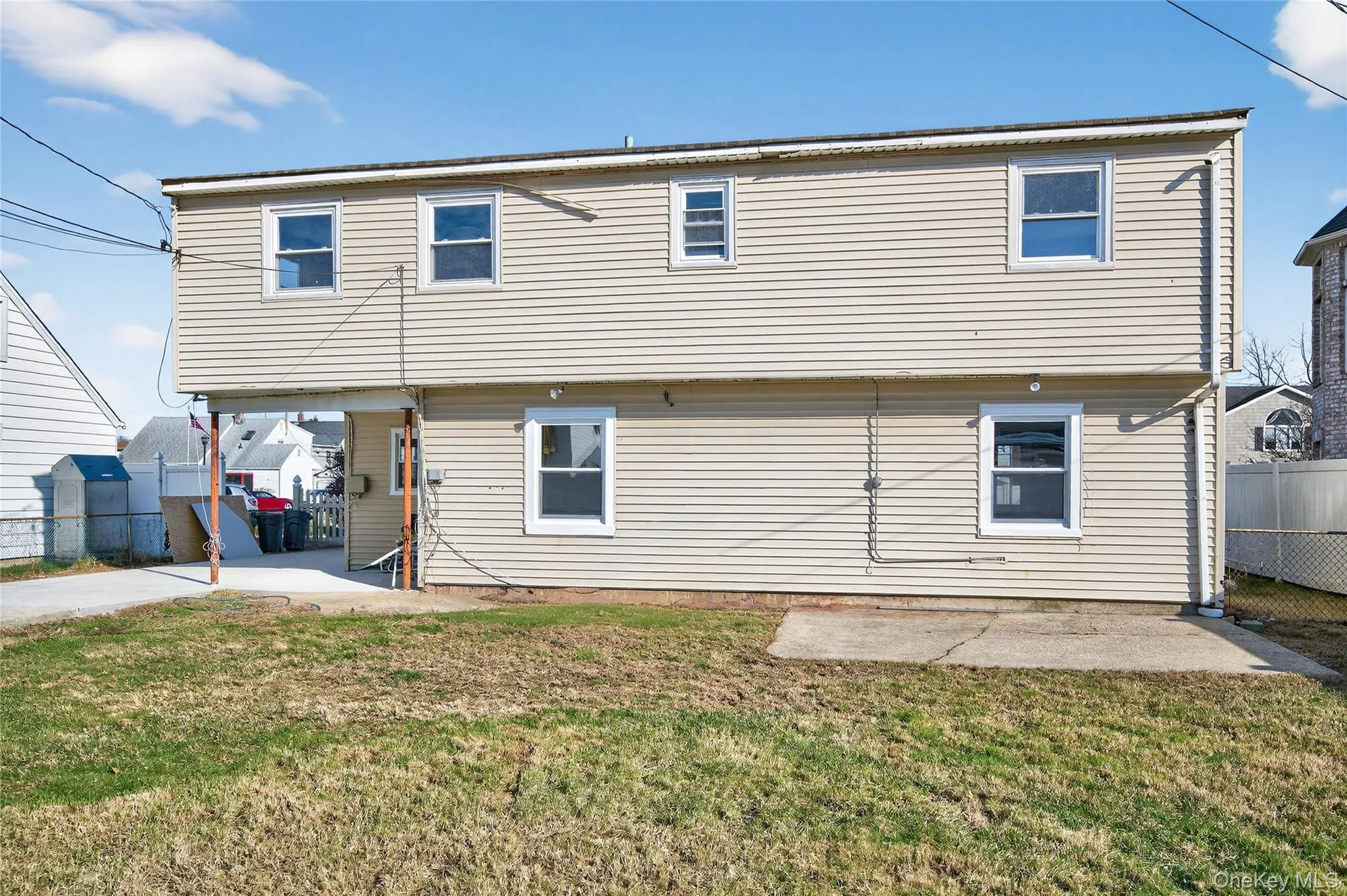 Rear view of house featuring a patio area Rear view of house featuring a patio area