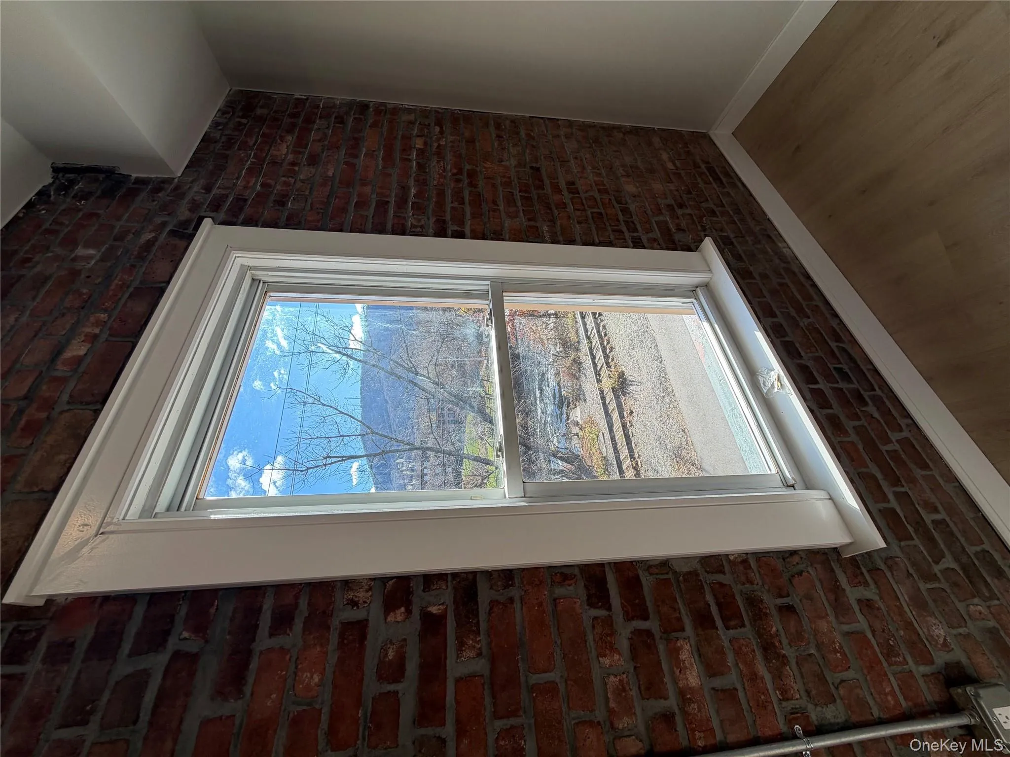 Detailed view of brick wall and wood finished floors Detailed view of brick wall and wood finished floors