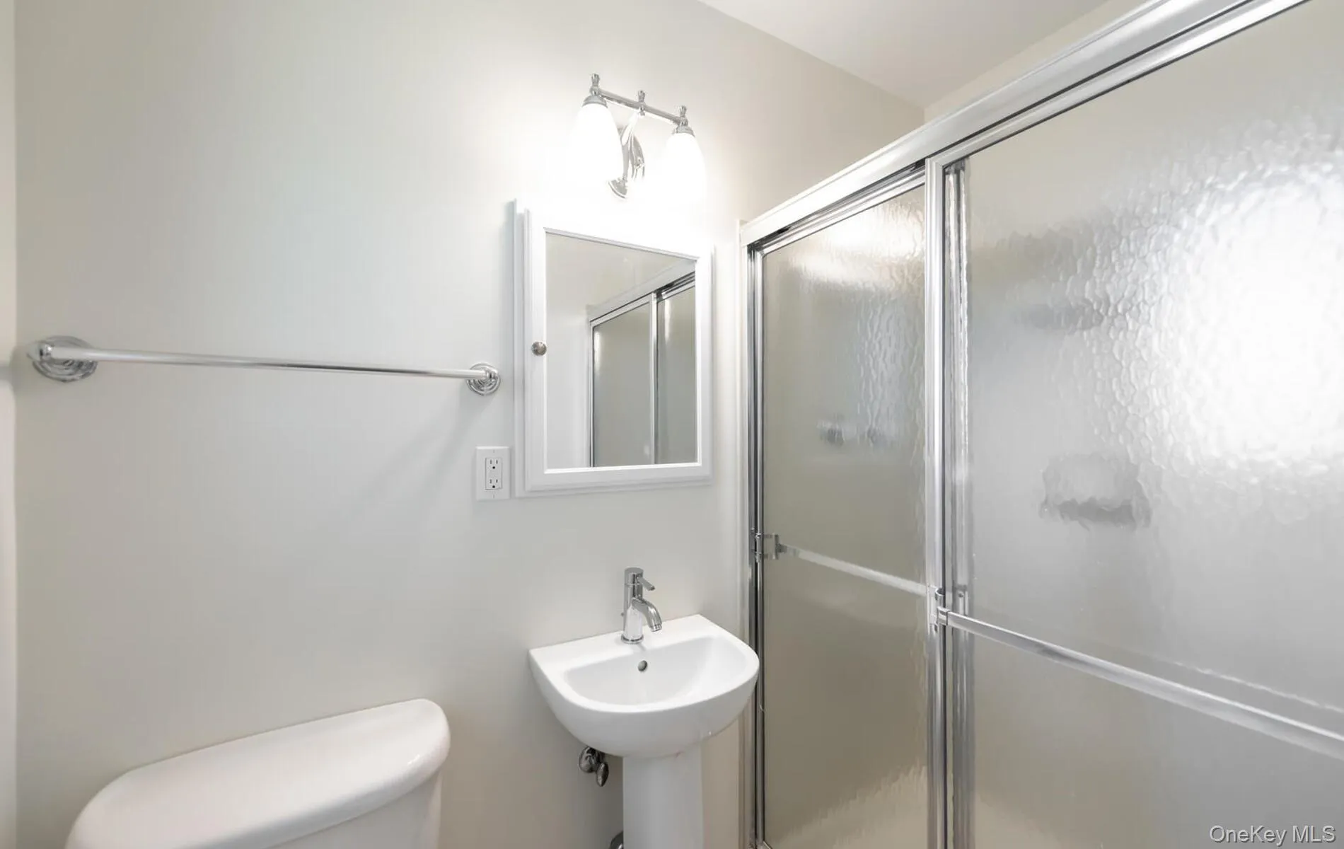 Full bath with a shower stall and toilet Full bath with a shower stall and toilet