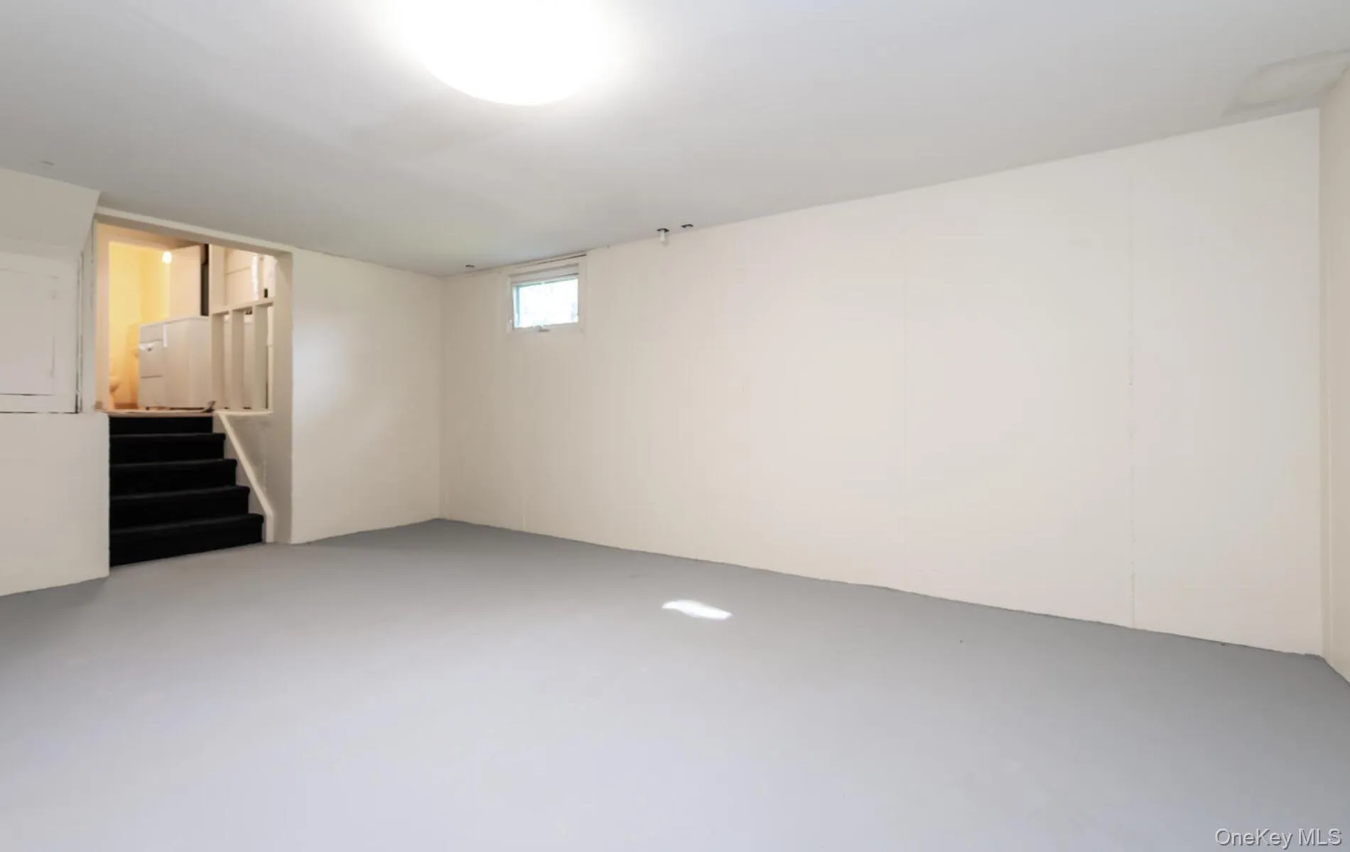 Basement featuring stairs Basement featuring stairs