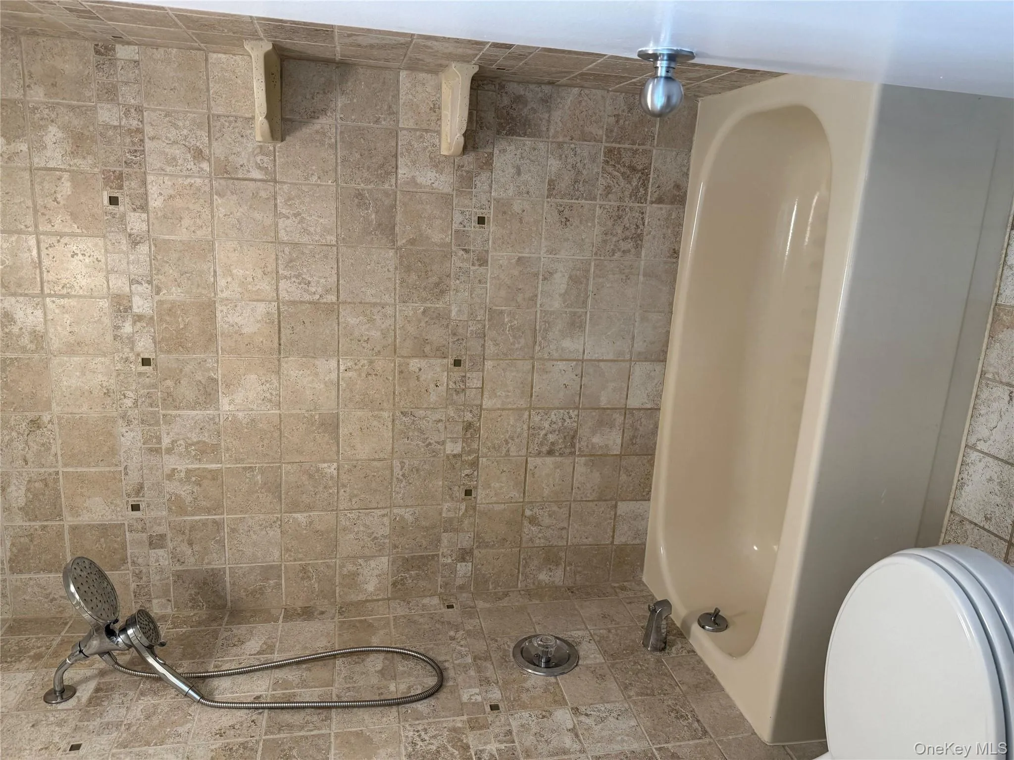 Full bath featuring bathtub / shower and toilet Full bath featuring bathtub / shower and toilet