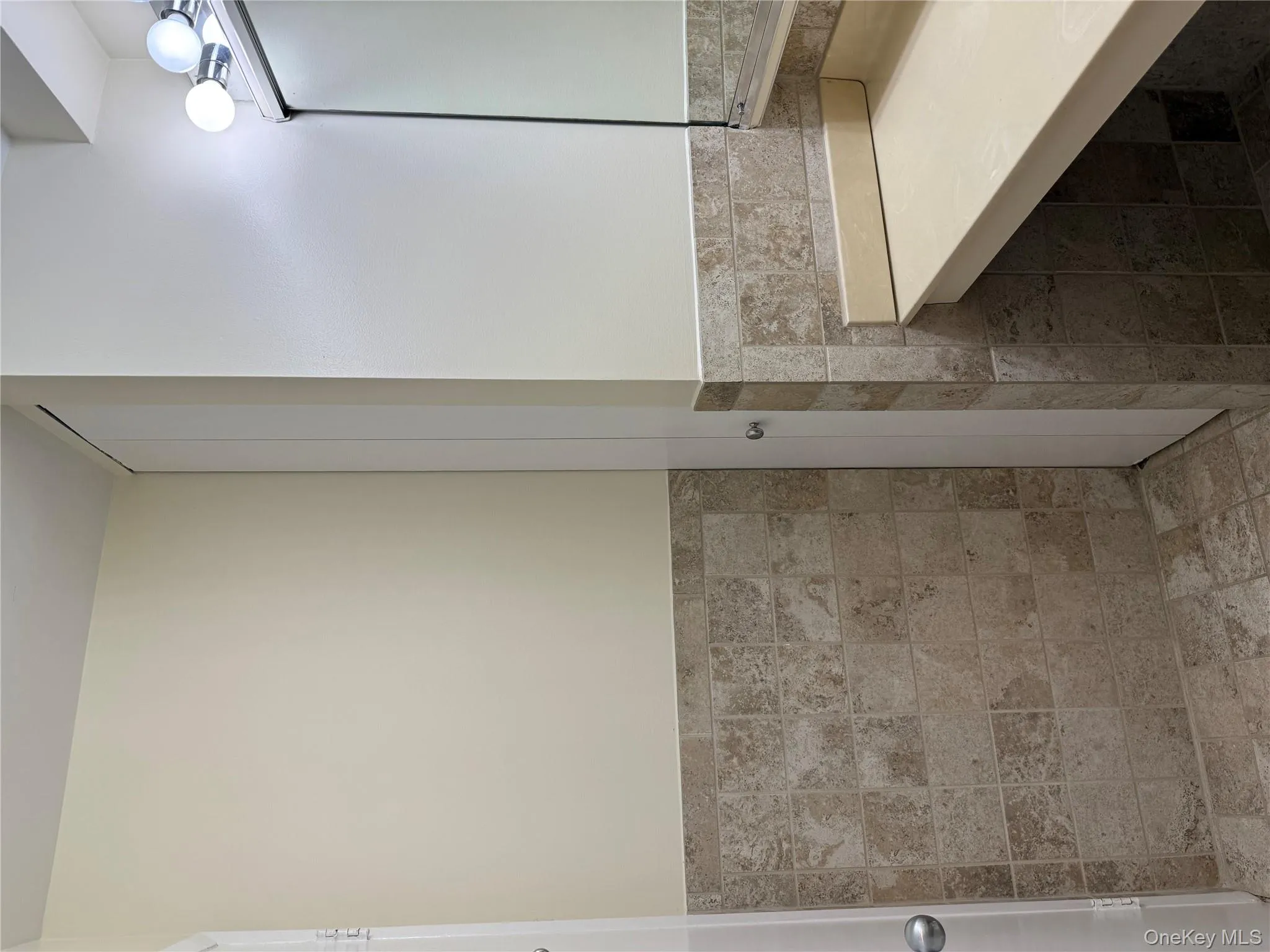 Beautiful tiling and convienient linen closet Beautiful tiling and convienient linen closet