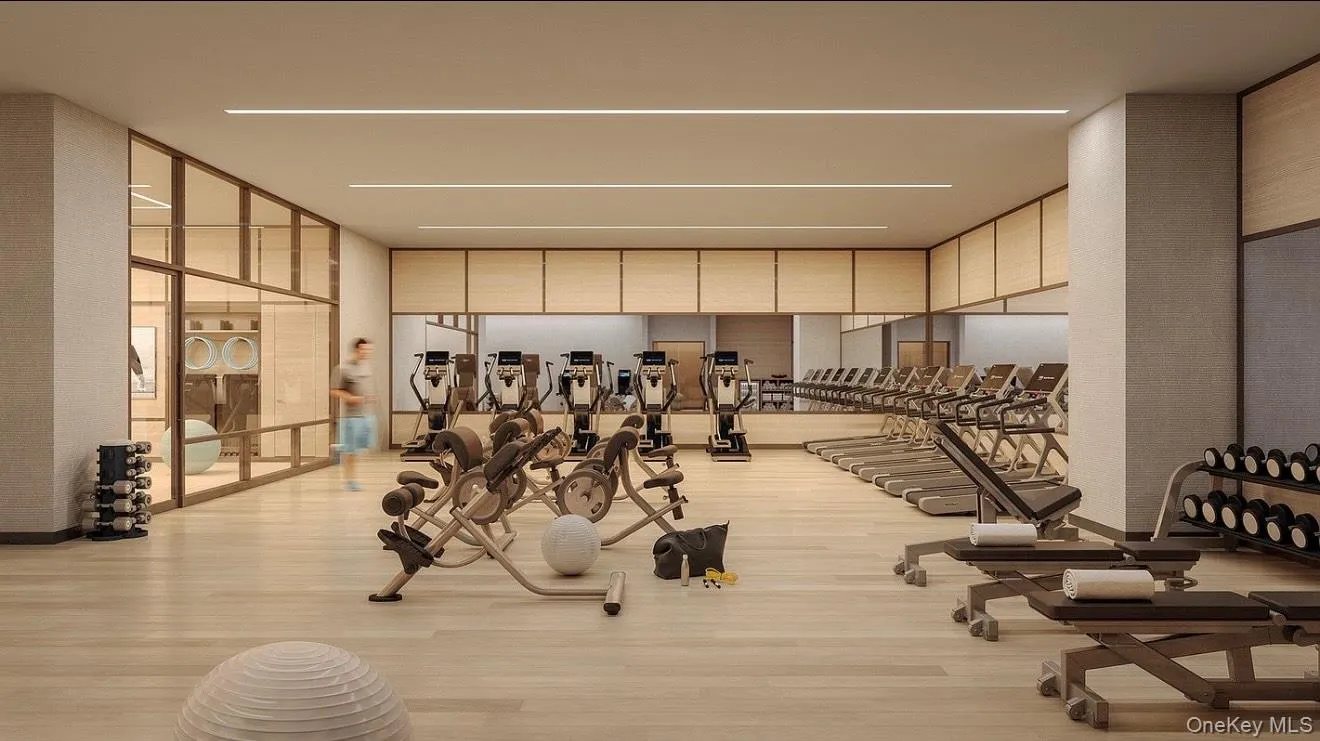 Workout area with a wall of windows Workout area with a wall of windows