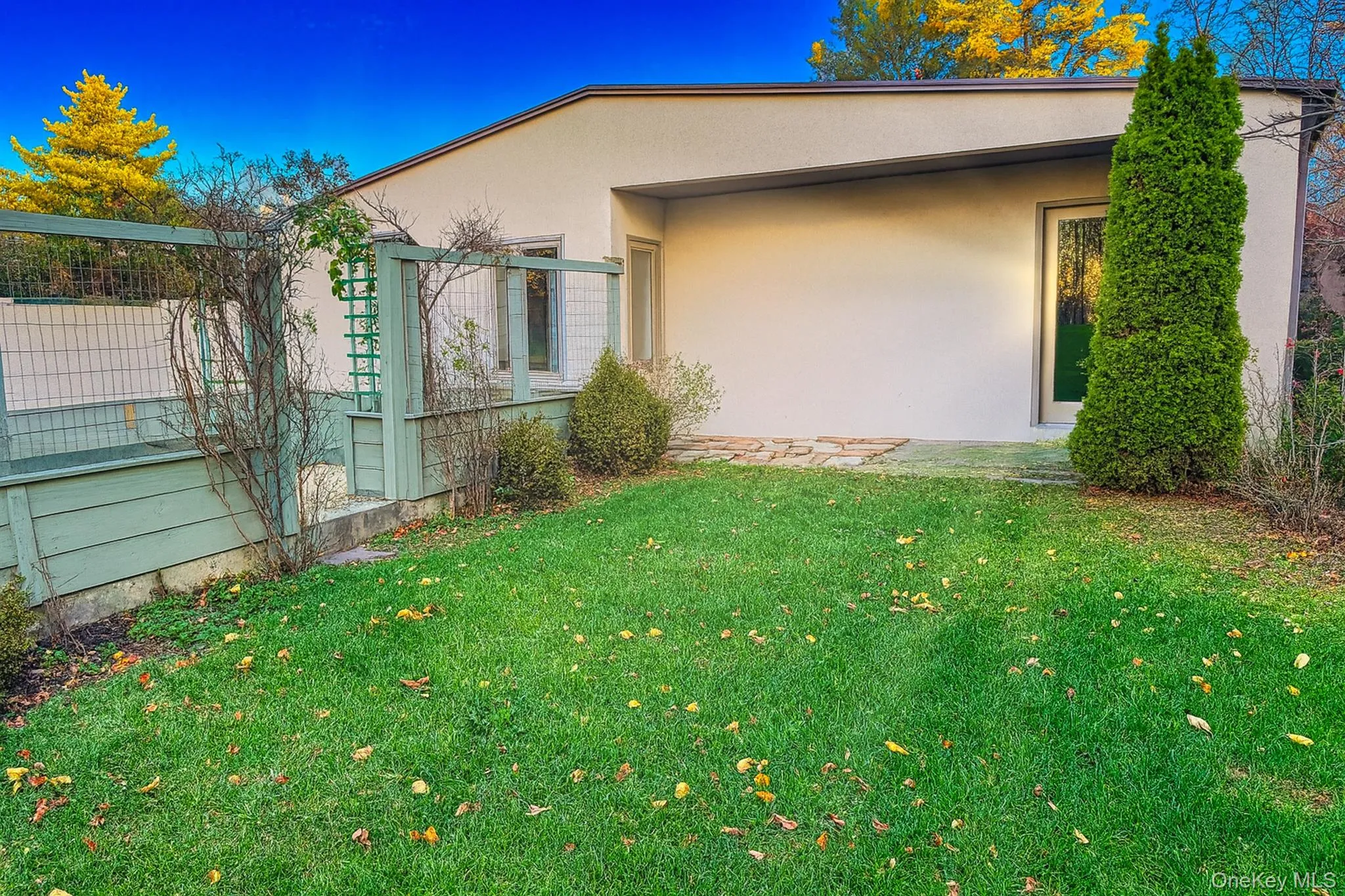 View of property exterior featuring stucco siding View of property exterior featuring stucco siding