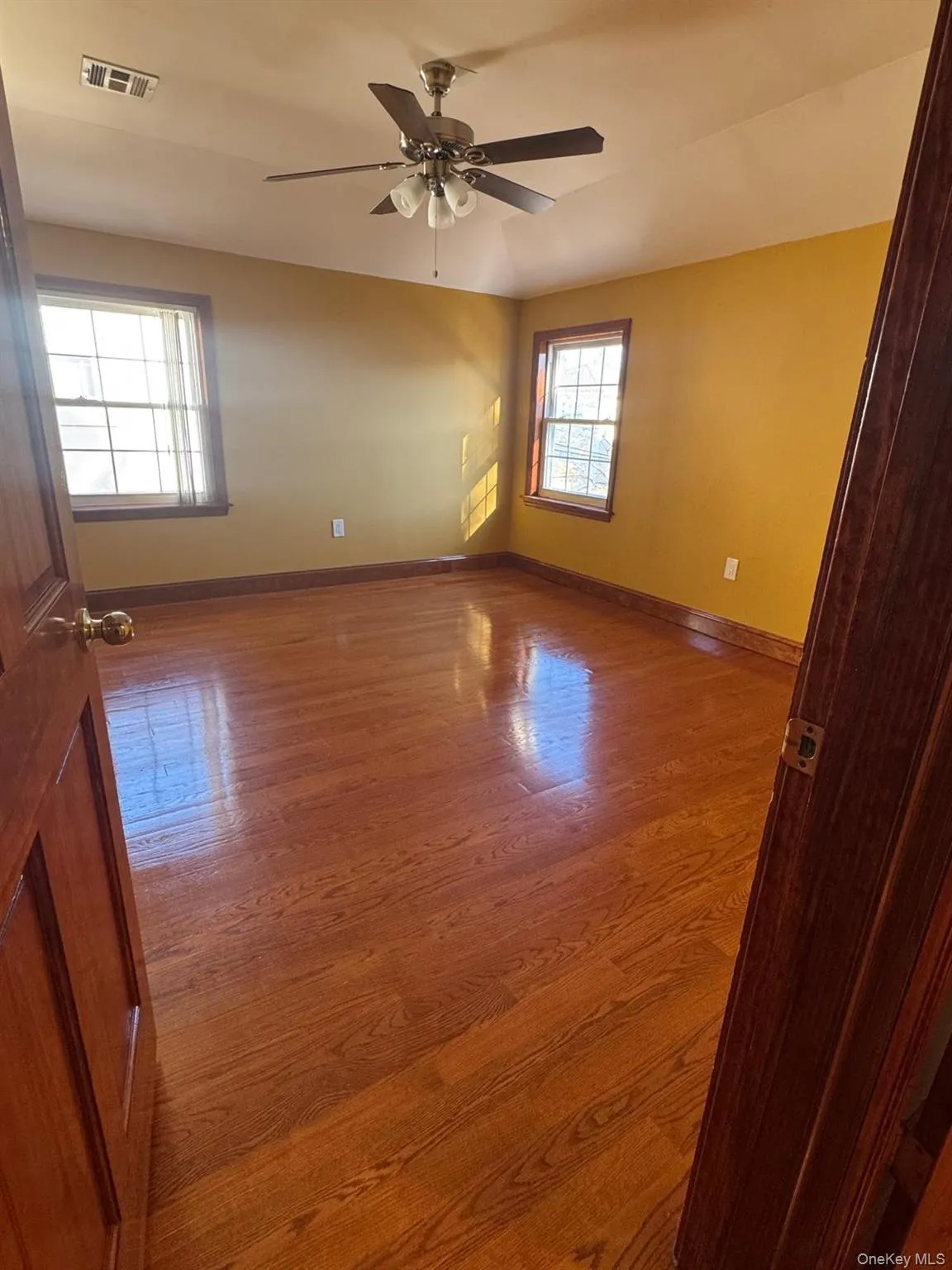 Unfurnished room with light wood-style flooring Unfurnished room with light wood-style flooring