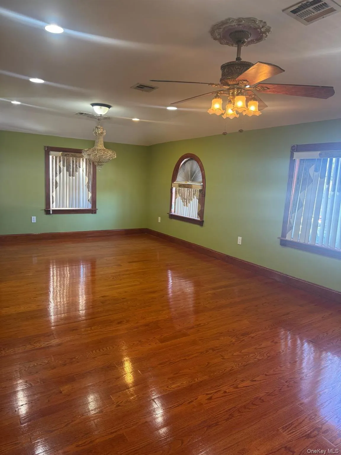 Unfurnished room featuring wood finished floors, recessed lighting, and ceiling fan Unfurnished room featuring wood finished floors, recessed lighting, and ceiling fan