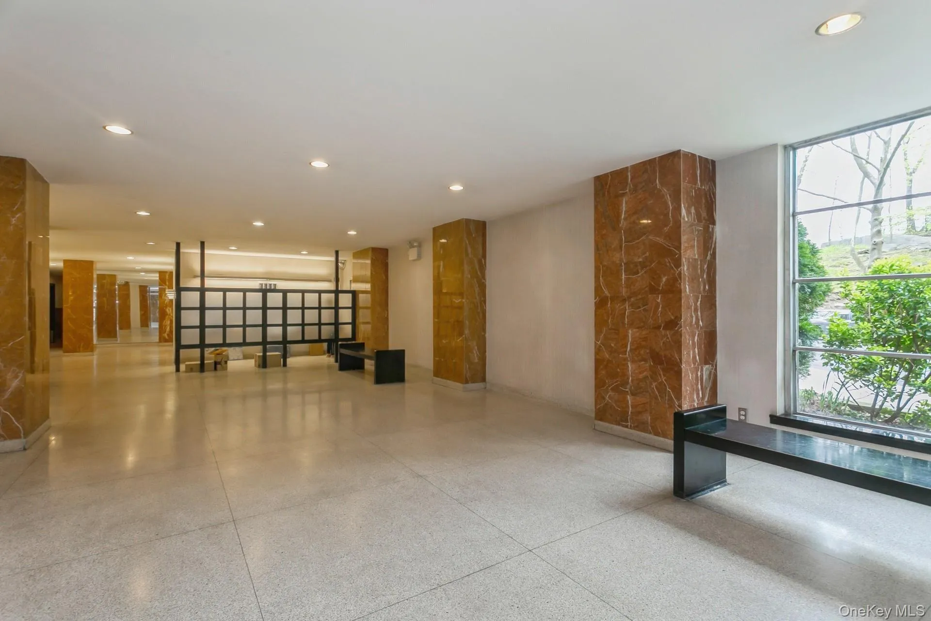 Building lobby featuring recessed lighting Building lobby featuring recessed lighting