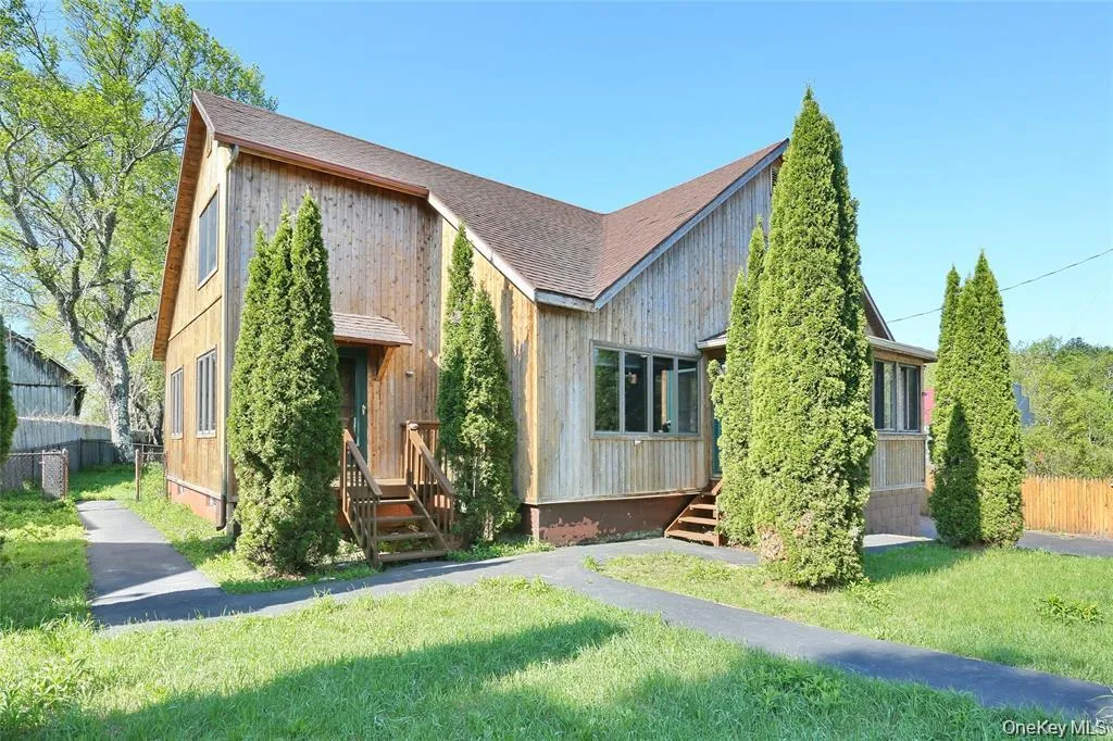 View of front of house featuring a shingled roof View of front of house featuring a shingled roof