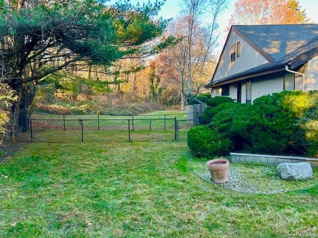 View of side yard with pet run. View of side yard with pet run.