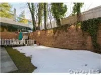 Snowy yard featuring a fenced backyard Snowy yard featuring a fenced backyard