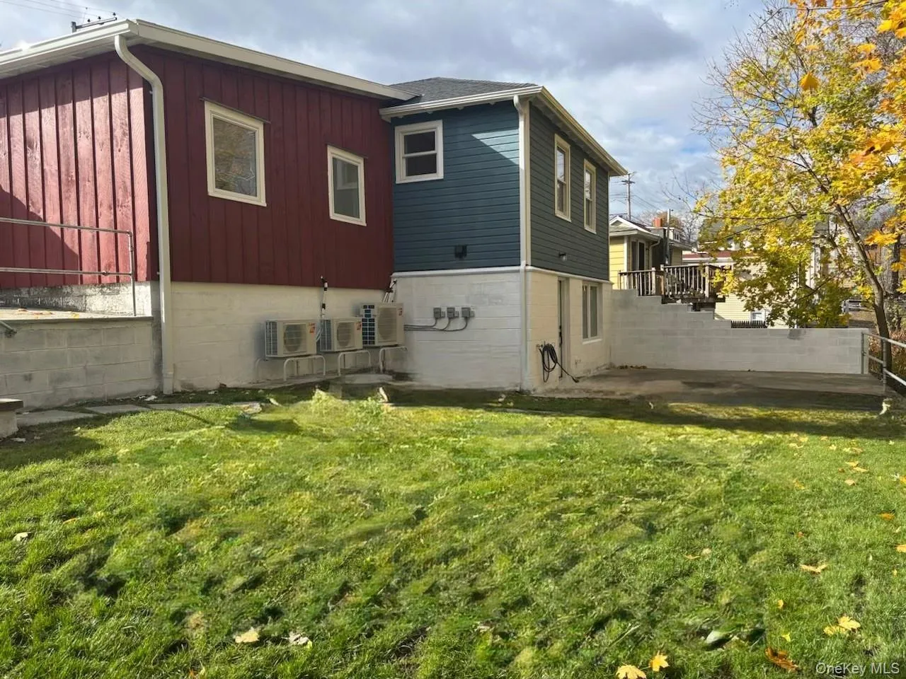 Back of property featuring board and batten siding Back of property featuring board and batten siding