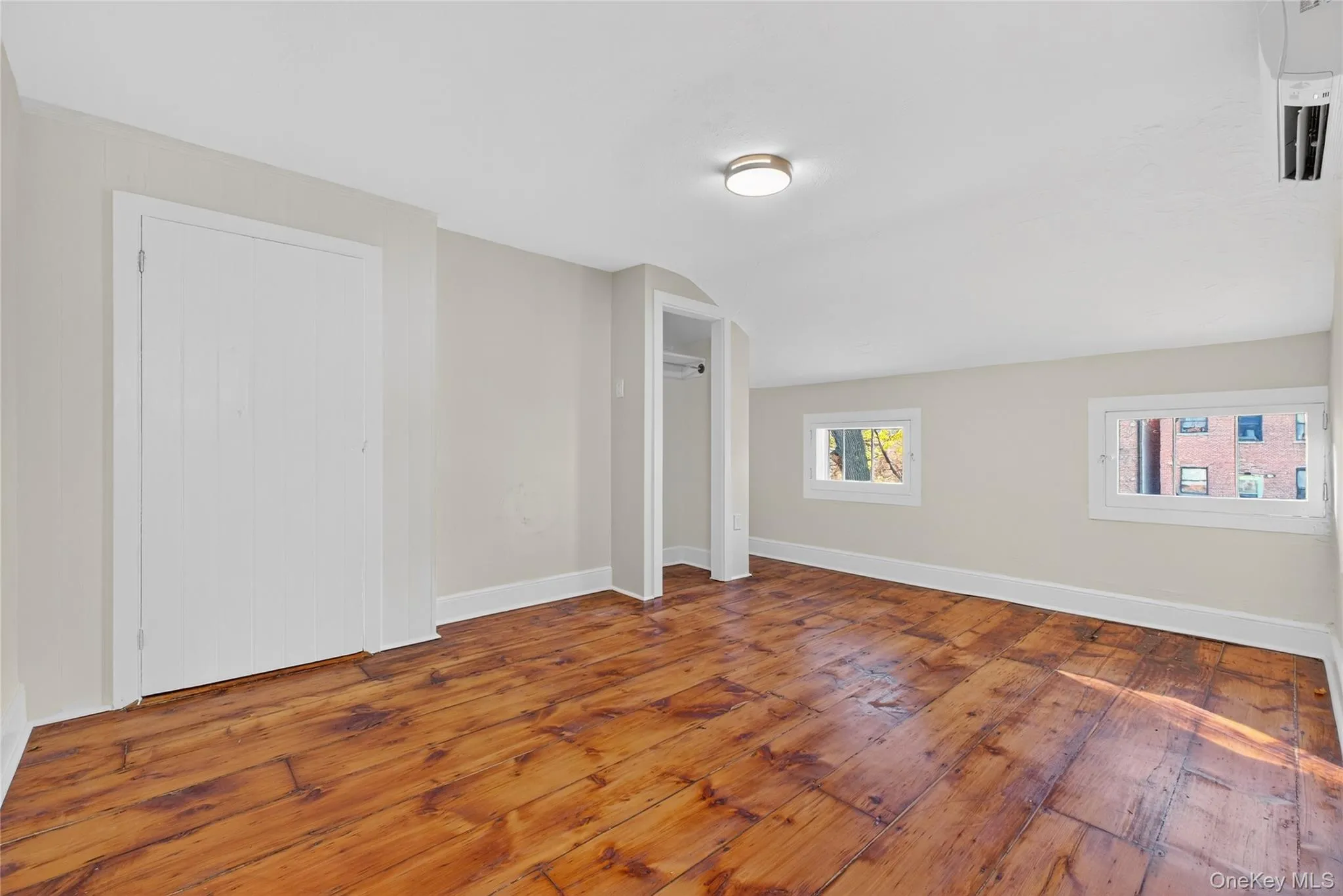 Bonus room featuring hardwood / wood-style flooring and vaulted ceiling Bonus room featuring hardwood / wood-style flooring and vaulted ceiling