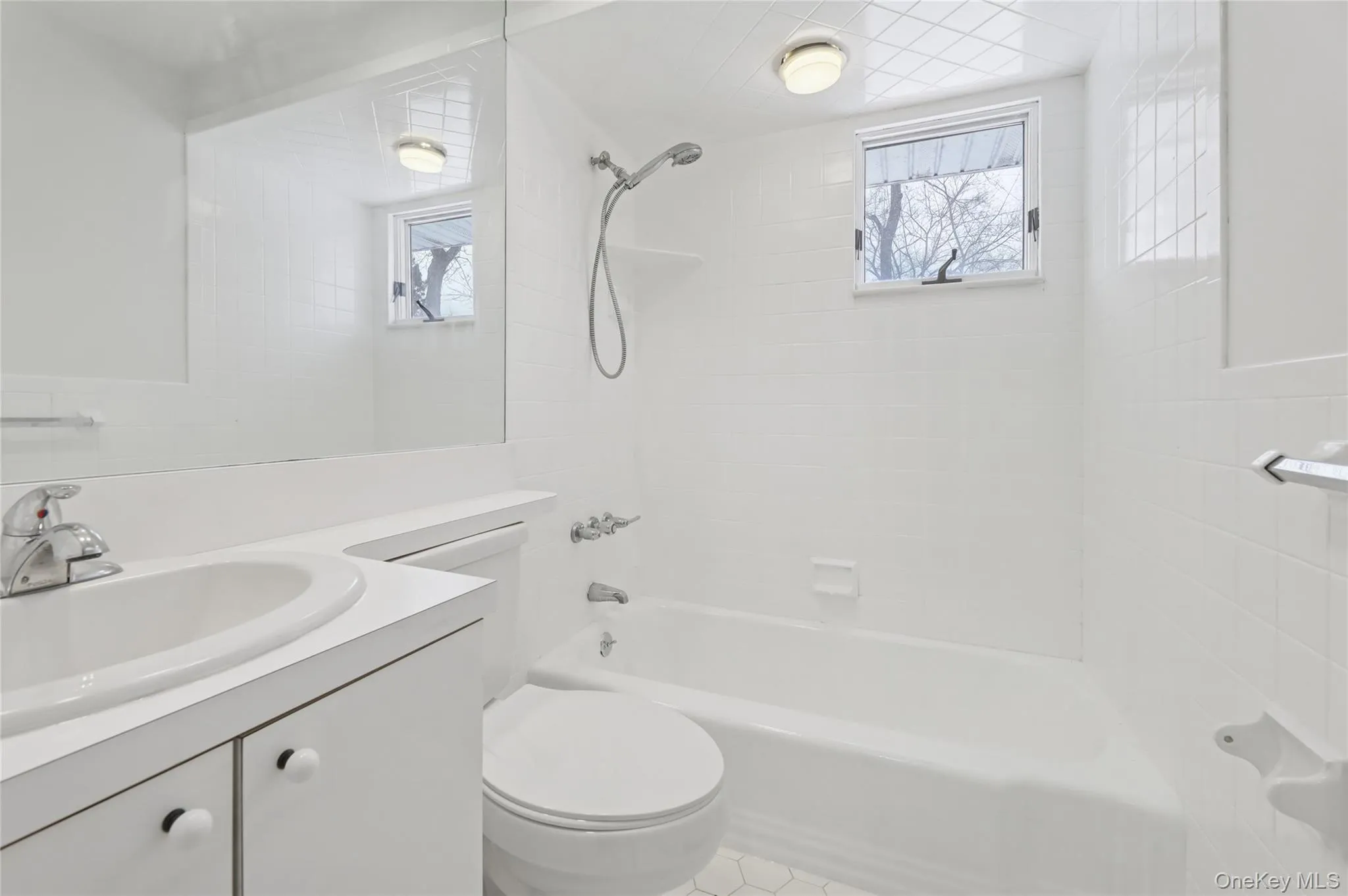 Full bath featuring vanity and shower / bath combination Full bath featuring vanity and shower / bath combination