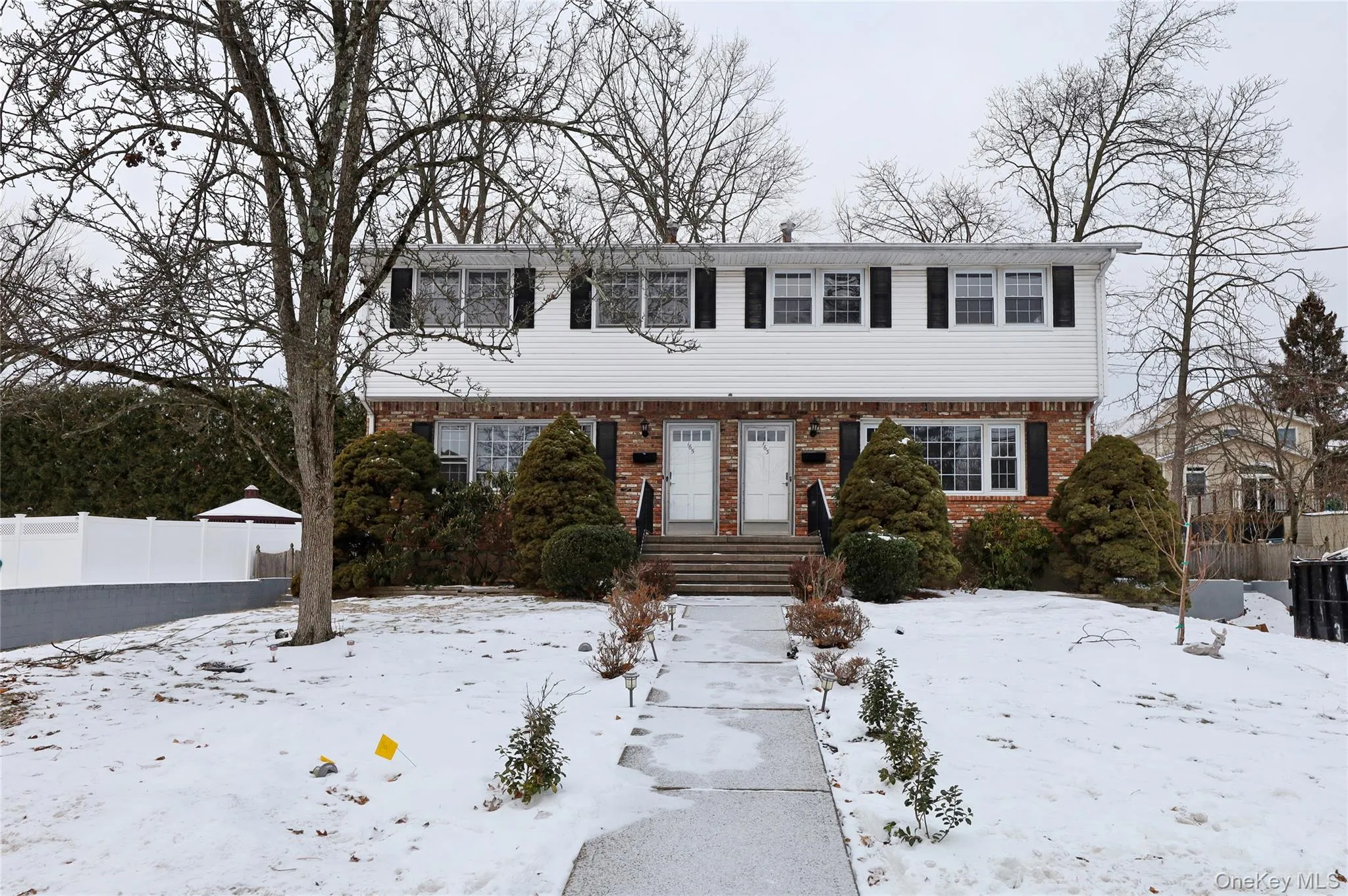 Colonial house with brick siding Colonial house with brick siding