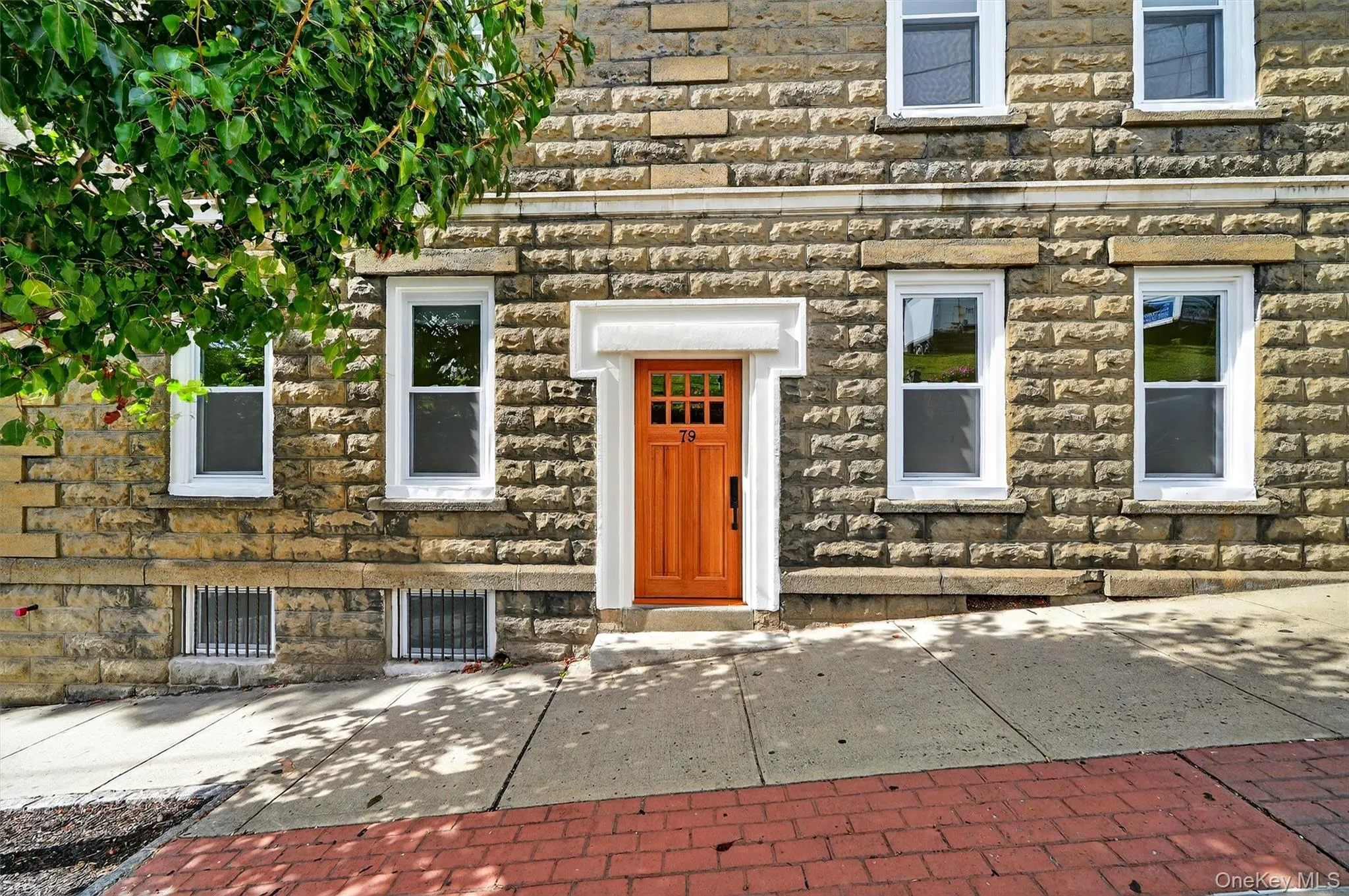 Entrance to property featuring stone siding Entrance to property featuring stone siding