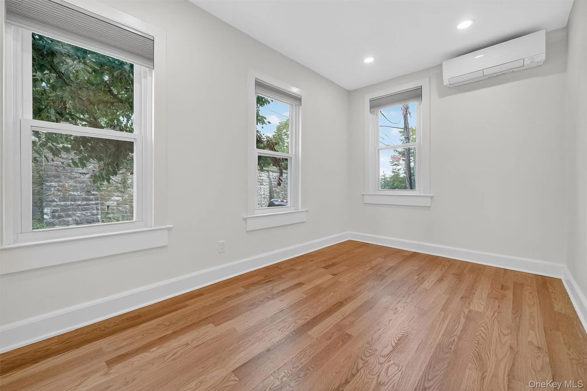 Bedroom with gleaming hardwood floors. Bedroom with gleaming hardwood floors.