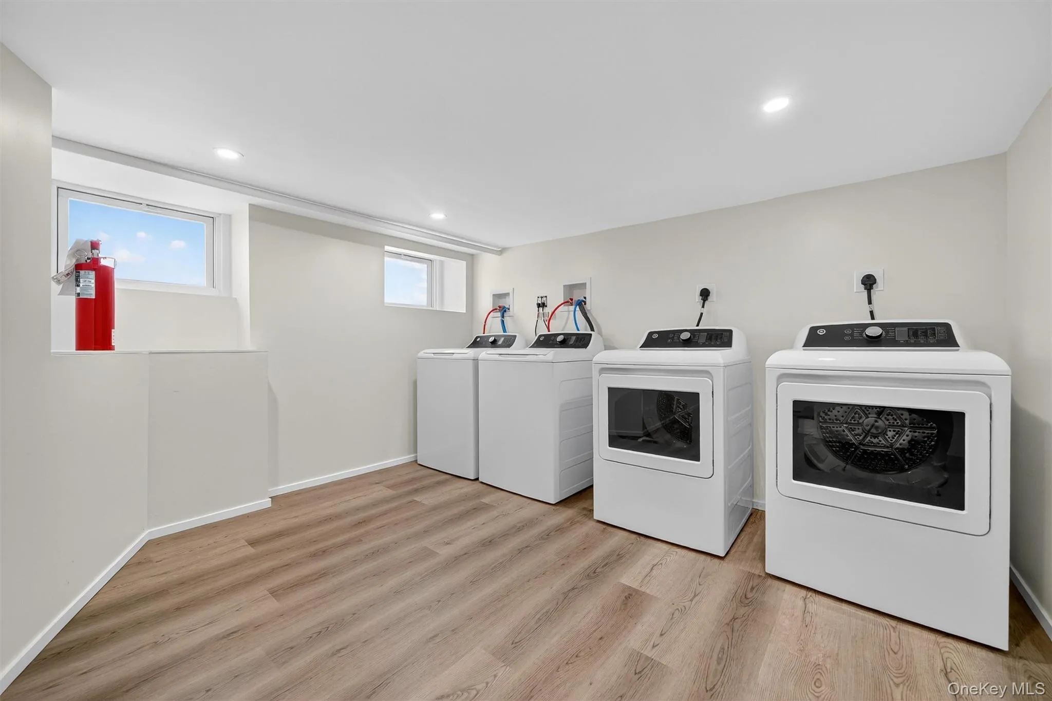 Laundry room with washers & dryers Laundry room with washers & dryers