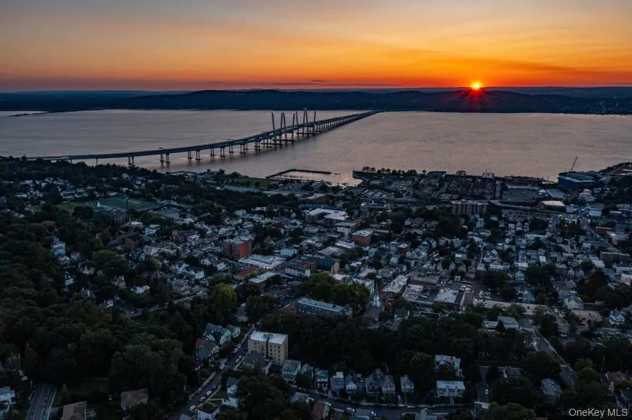 Aerial view at dusk of a notable bridge and a water view Aerial view at dusk of a notable bridge and a water view