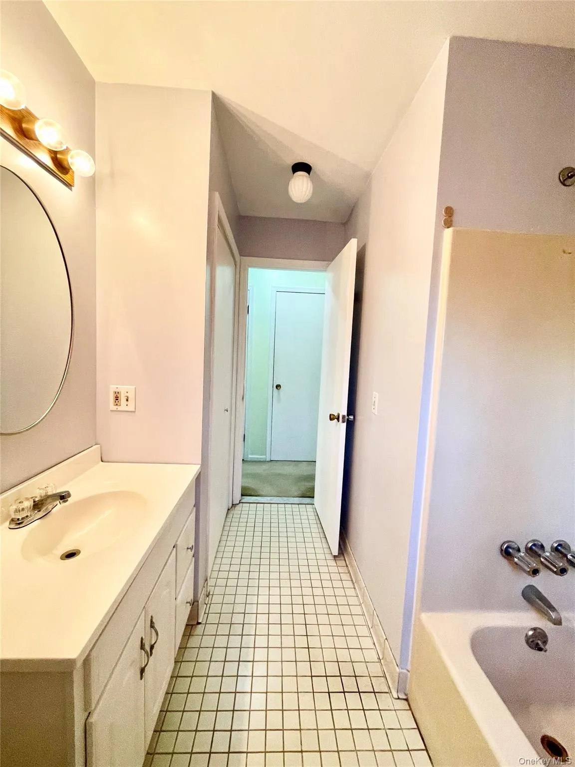 Full bath with vanity, shower / tub combination, and light tile patterned flooring Full bath with vanity, shower / tub combination, and light tile patterned flooring