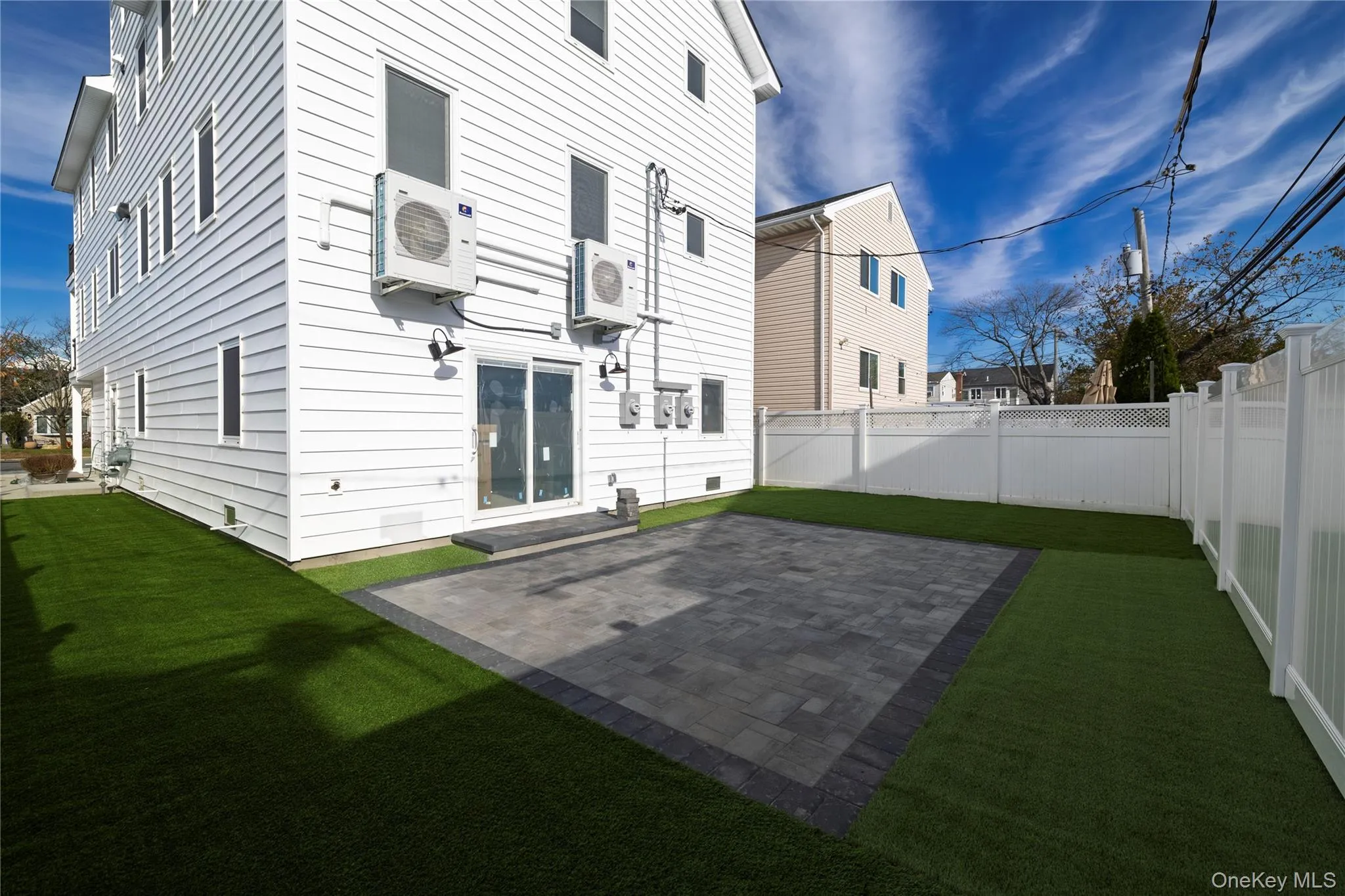 Back of property with a patio and a fenced backyard Back of property with a patio and a fenced backyard