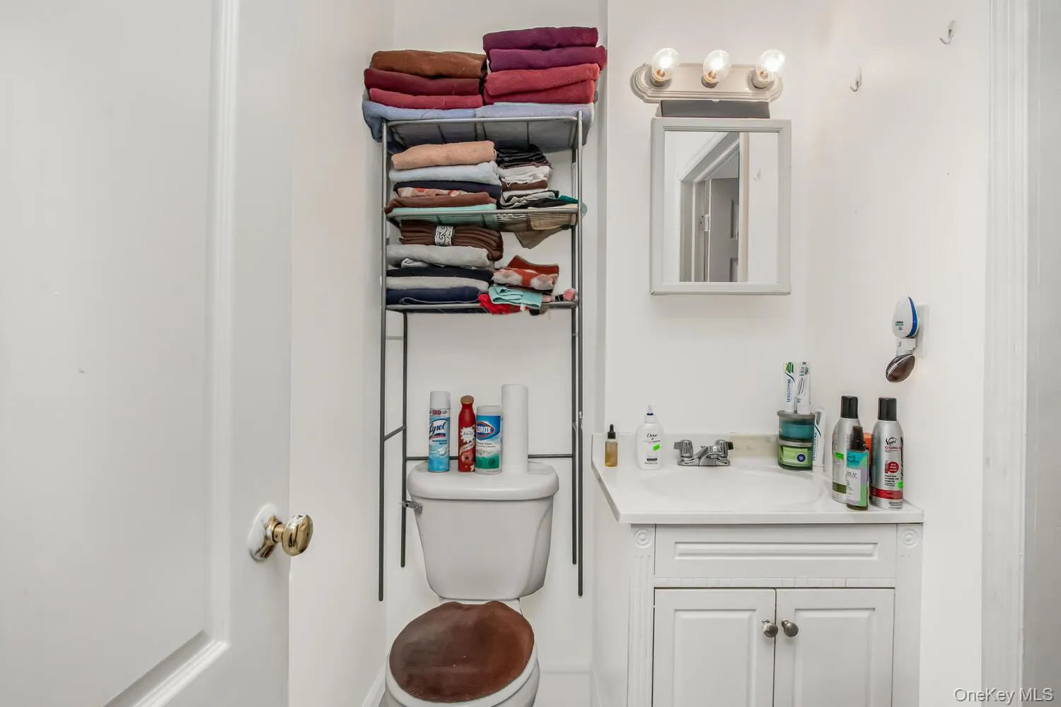 Bathroom with toilet and vanity Bathroom with toilet and vanity