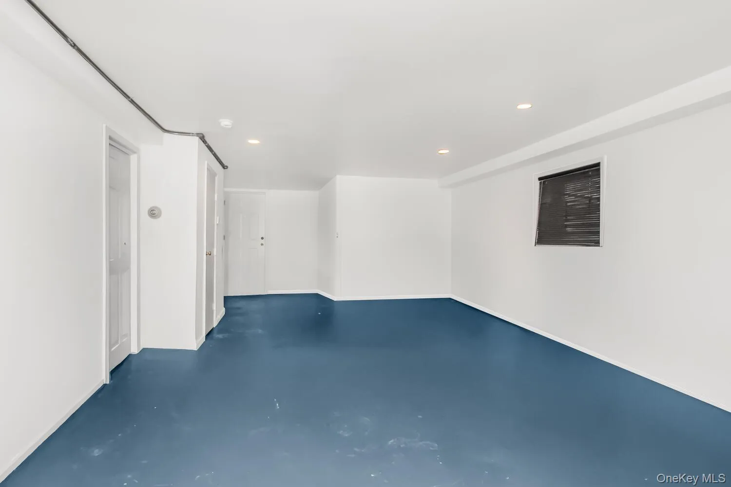 Below grade area with recessed lighting Below grade area with recessed lighting